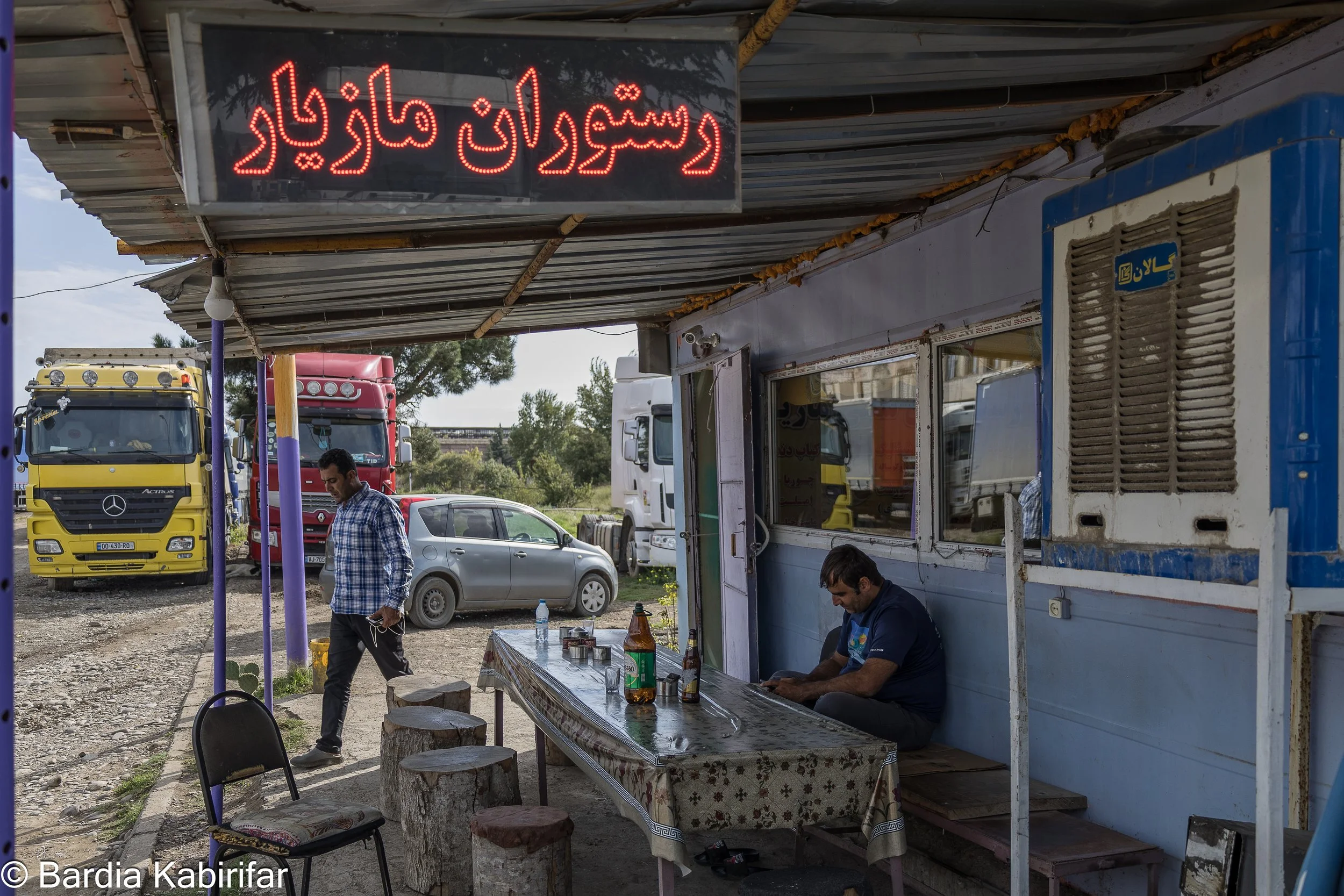 Iranian truck drivers spending time in a small Iranian restaurant on the outskirts of Tbilisi. The community has much expanded over the time that currently several truck parking spots around Tbilisi, as well as other cities around the country, are co