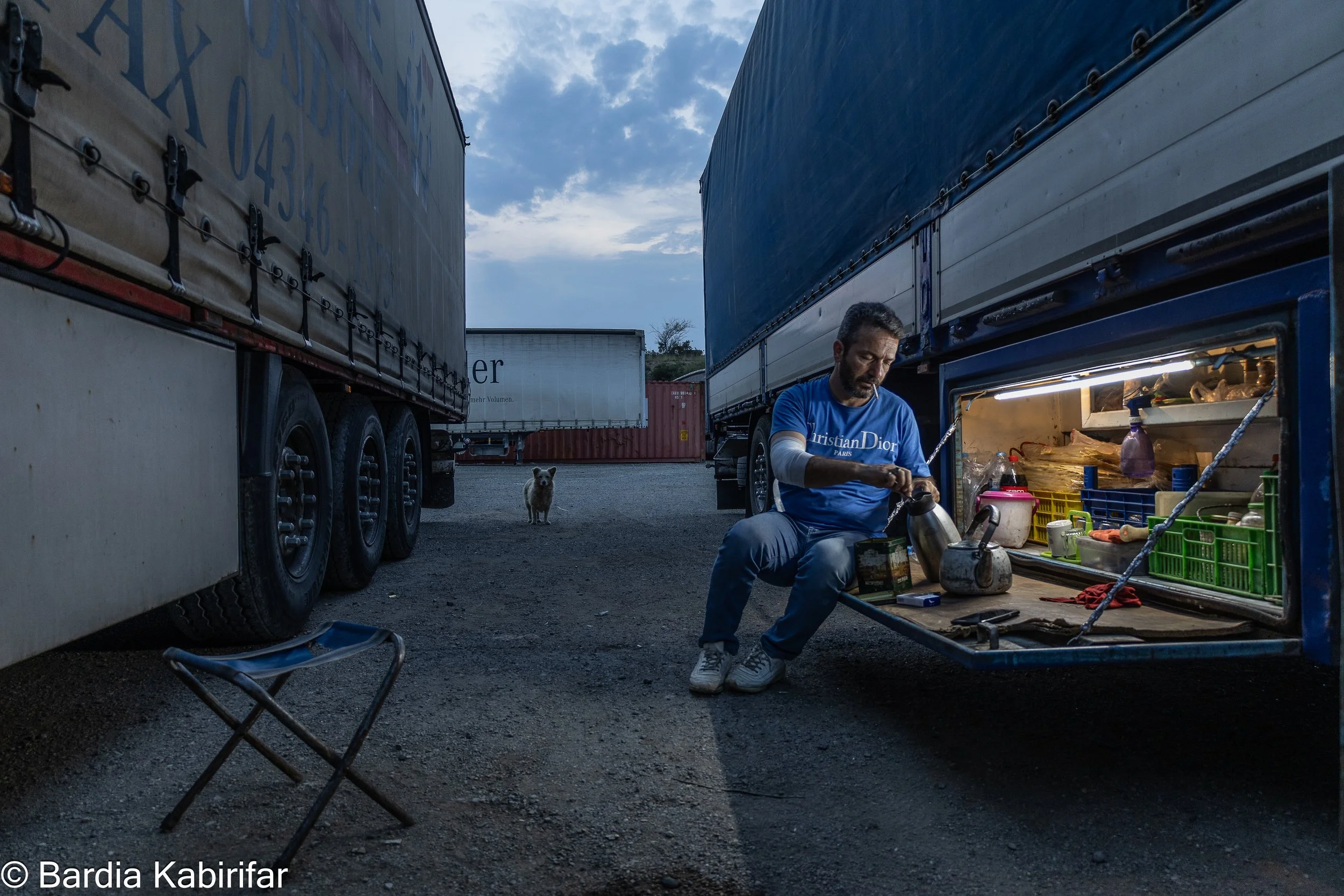 Akbar prepares tea at his truck's kitchen, or 'box' as called by the truckers, on the outskirts of Tbilisi. Hundreds of Iranian truck drivers are involved in Georgia's international trade. 
Working as a trucker means spending most of your time far fr