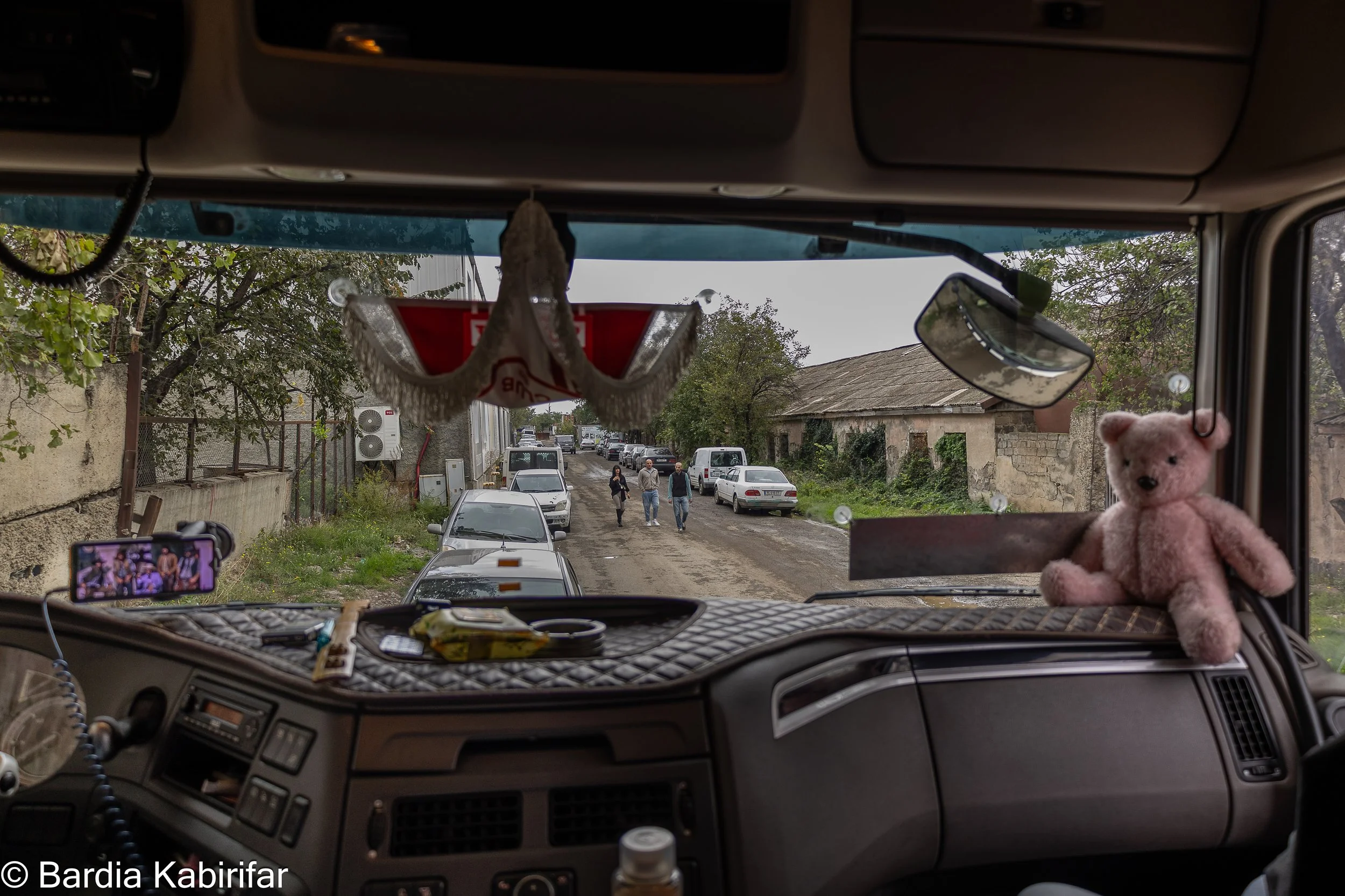 Akbar is waiting for his turn to unload the goods he imported from Iran the day before. After arriving at Tbilisi, he has to announce his load to the customs before heading to the delivery spot. (October 2nd, 2023 Tbilisi, Georgia)