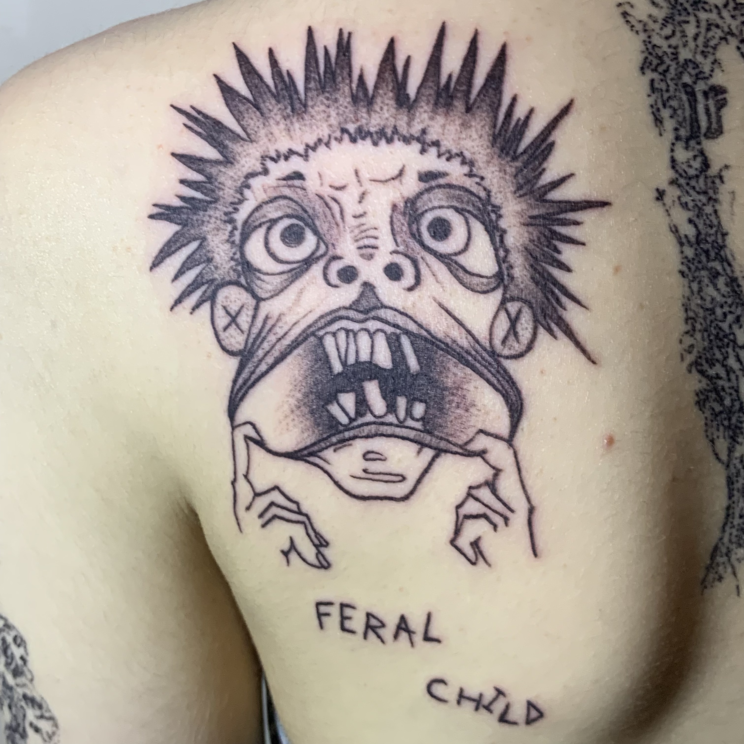 feral child tattoo.png