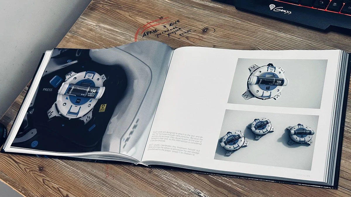 Open book displaying images and details of a medical or scientific device, possibly a pacemaker or implantable cardioverter-defibrillator (ICD). The device is shown from various angles.