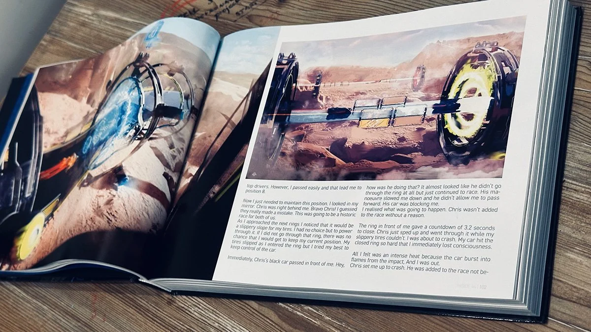 Open book with images of a futuristic racing car on a desert track, showing a crash scene with a car hitting a barrier and a close-up of a racing wheel and safety features.