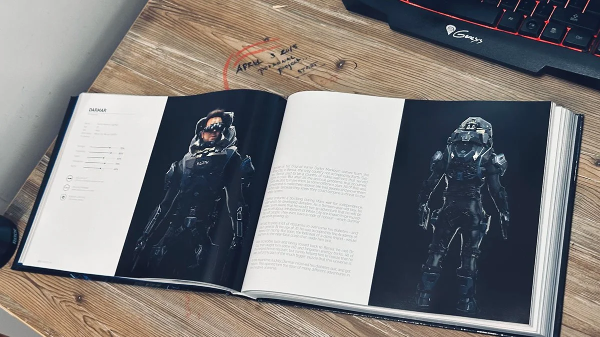 Open book displaying images of futuristic armored soldiers on a wooden desk.