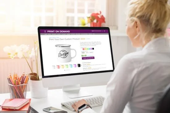 Woman looking at a computer screen displaying a custom mug design on an online print-on-demand website.