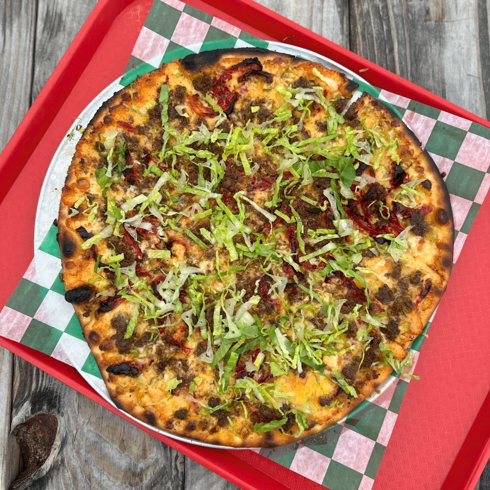 We thought it would be fun to collab with our sister location @rockwellbeercompany - drumroll please&hellip;. The Cheeseburger 🍔 Pizza 🍕 
Thousand island
Cheddar Cheese
Steakburger seasoned ground beef
Tomato 
Lettuce- while supplies last