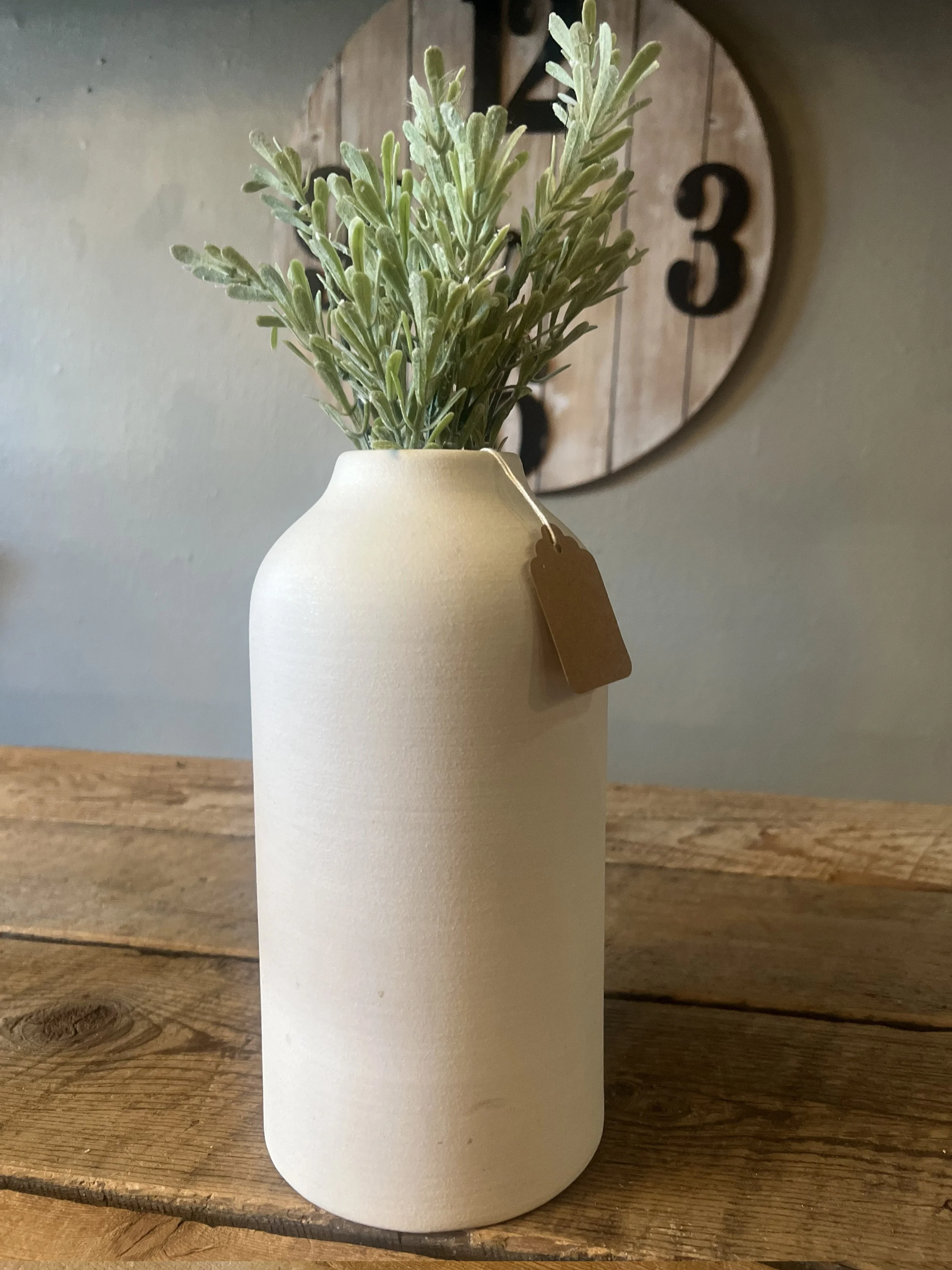 8 white pottery vase with greenery.jpg
