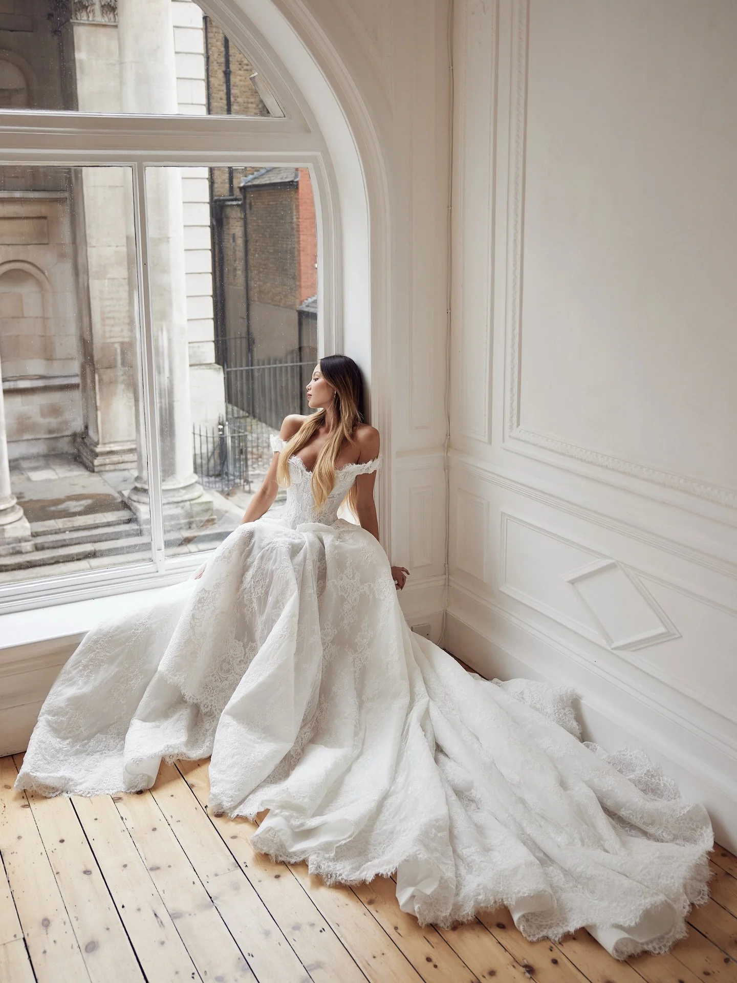 🤍HARMONY has all the hallmarks of a 19th century ballgown, with a contemporary feel. The waisted bodice with sweet , off the shoulder sleeves features a peplum of handsewn silk applique flowers which add drama at the hips. From behind Harmony featur