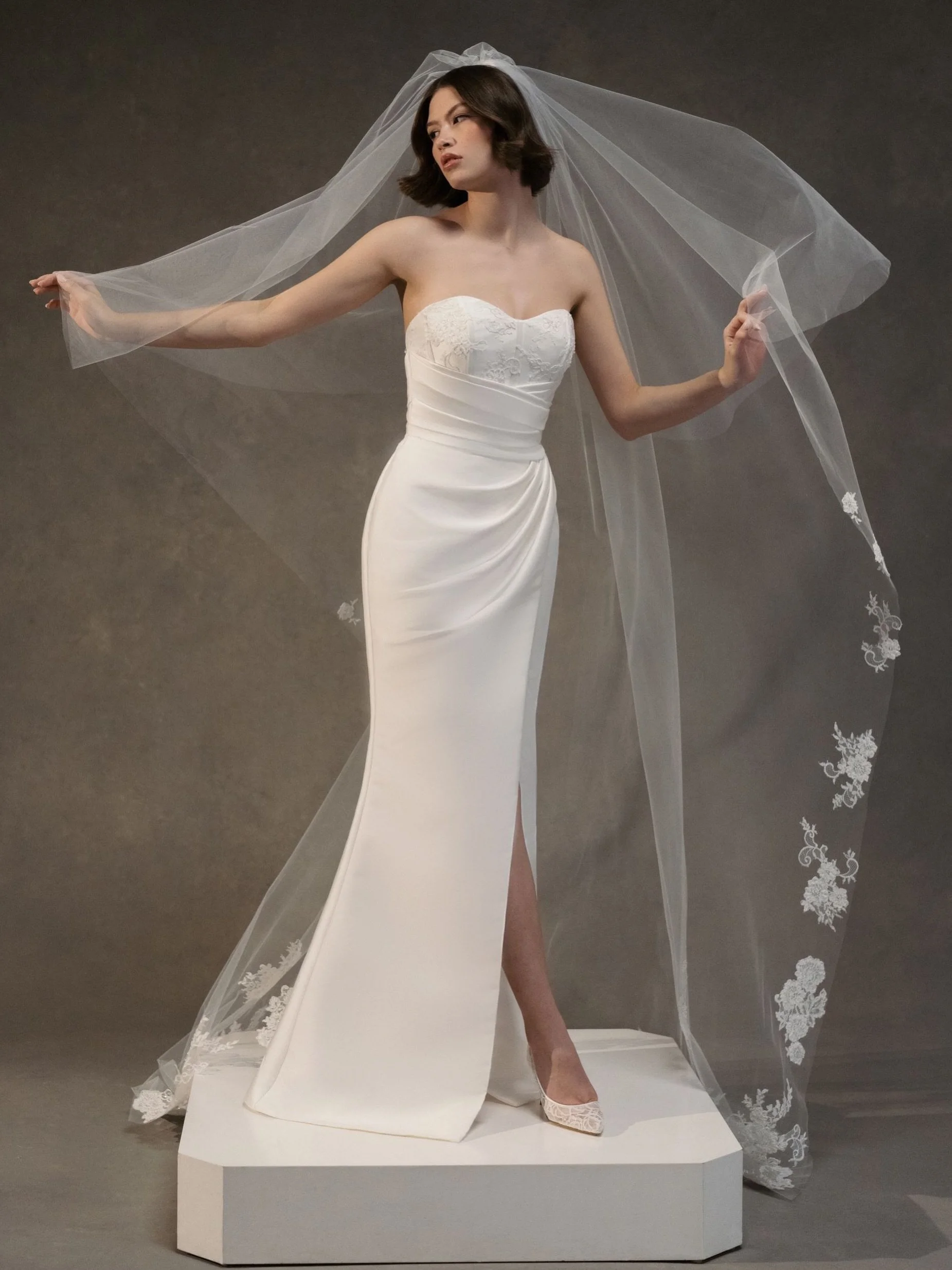 Meet LILA 🤍✨ The Lila wedding dress is a sweetheart bodice of Corded Lace, with draped skirt with slit of Soft Mikado and figure-flattering angled bodice draping featuring buttons to the hem in Silk White.

Add the Kaia Detachable Train. Dramatic de