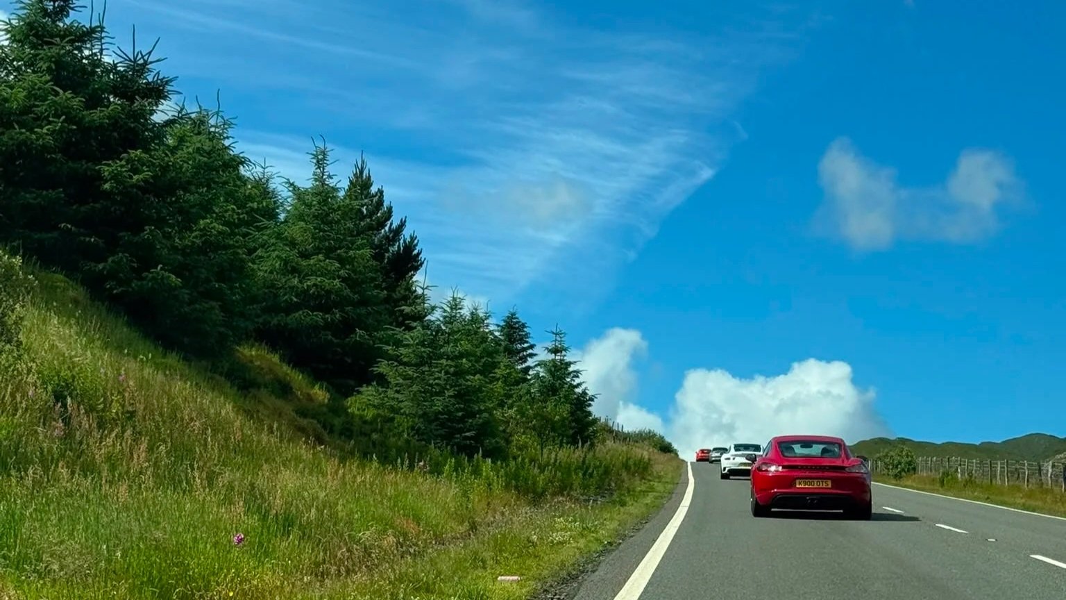 Porsche convoy driving through Snowdonia National Park during the Torque & Drive Wales Ascent