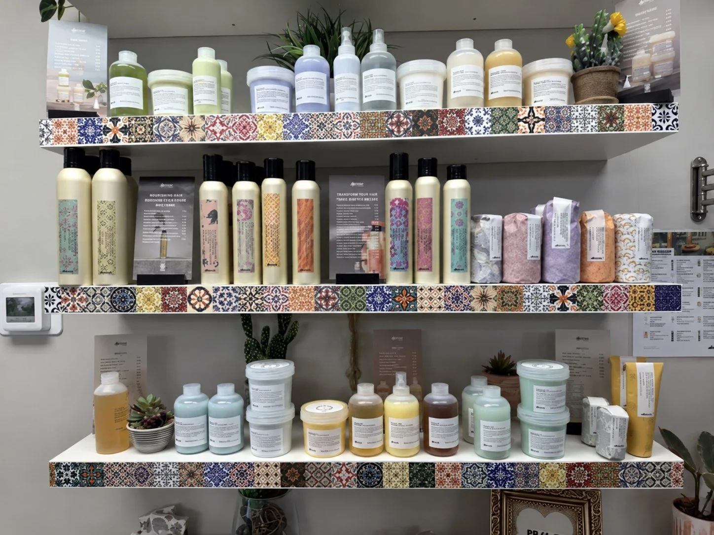 Davines haircare displayed on colorful shelves at Mechanix + Co.