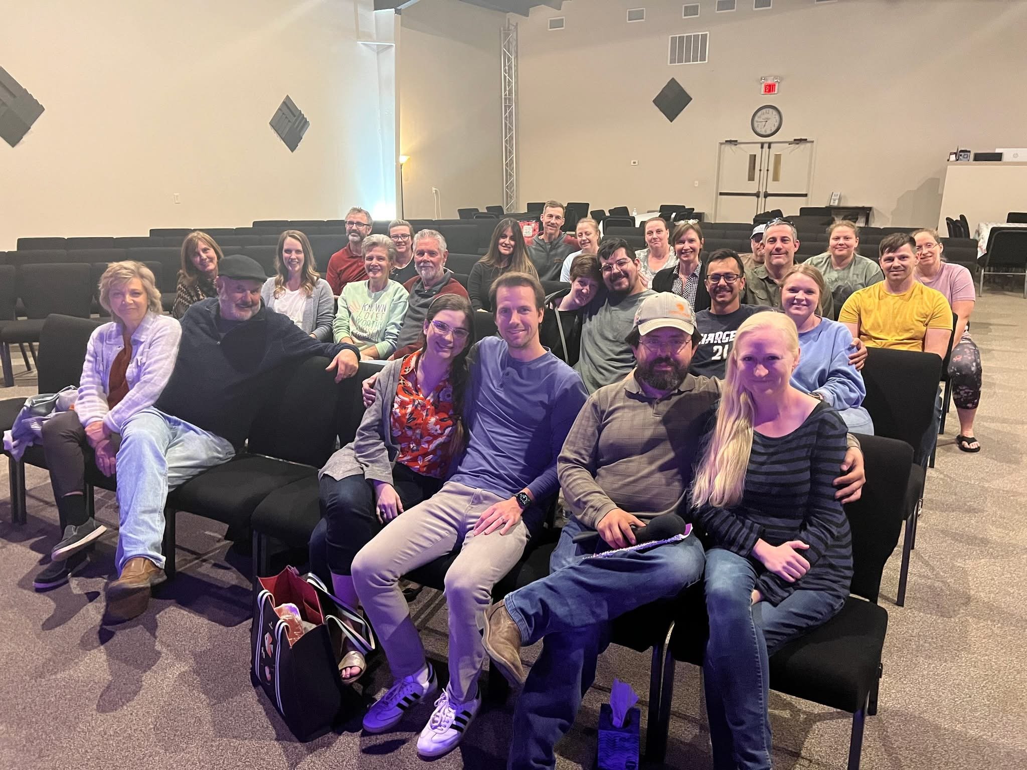 A couple holding hands outdoors with trees in the background, overlaid with text that reads 'The net fellowship married'.