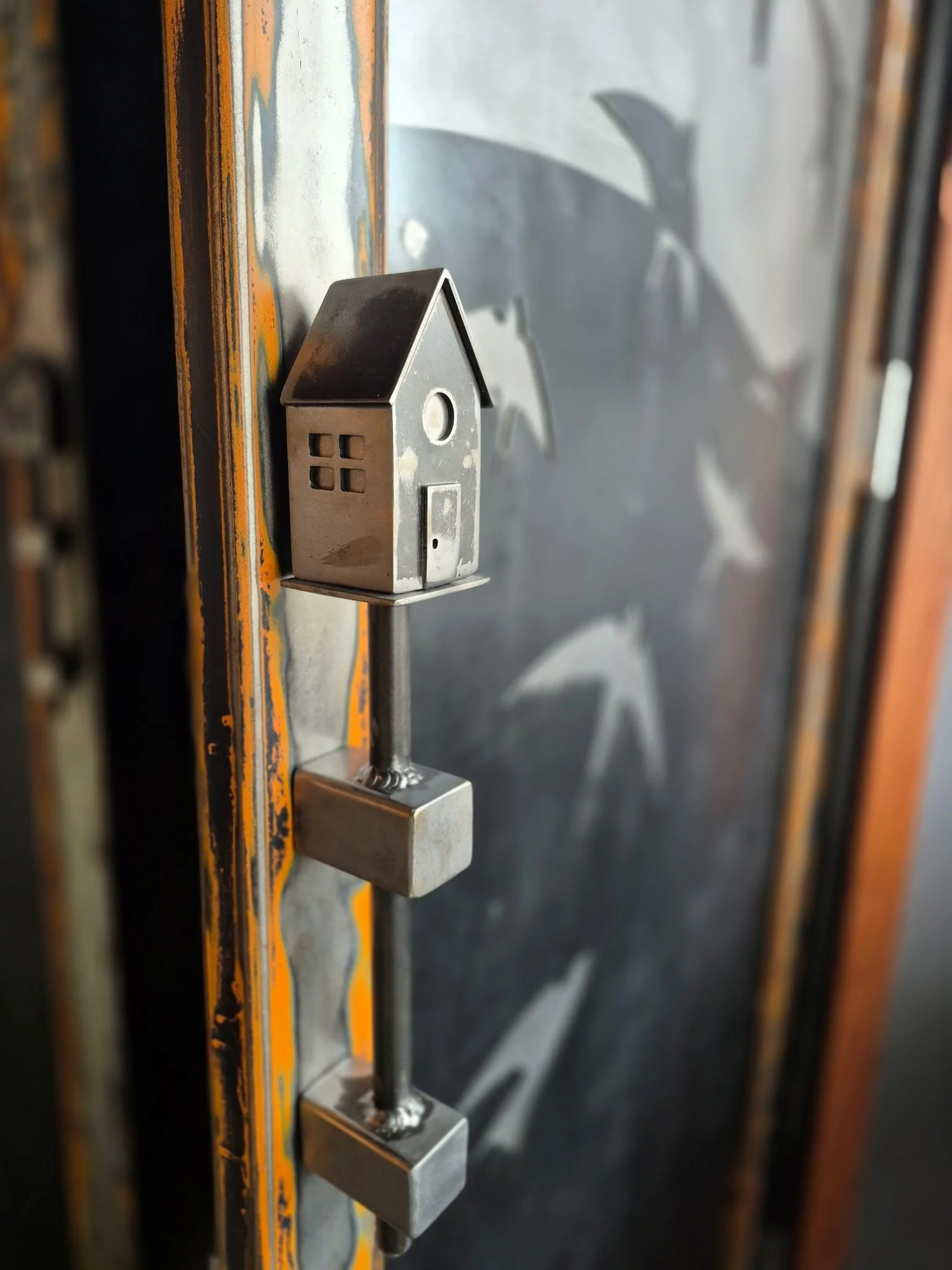 Custom fabricated metal birdhouse door pull 