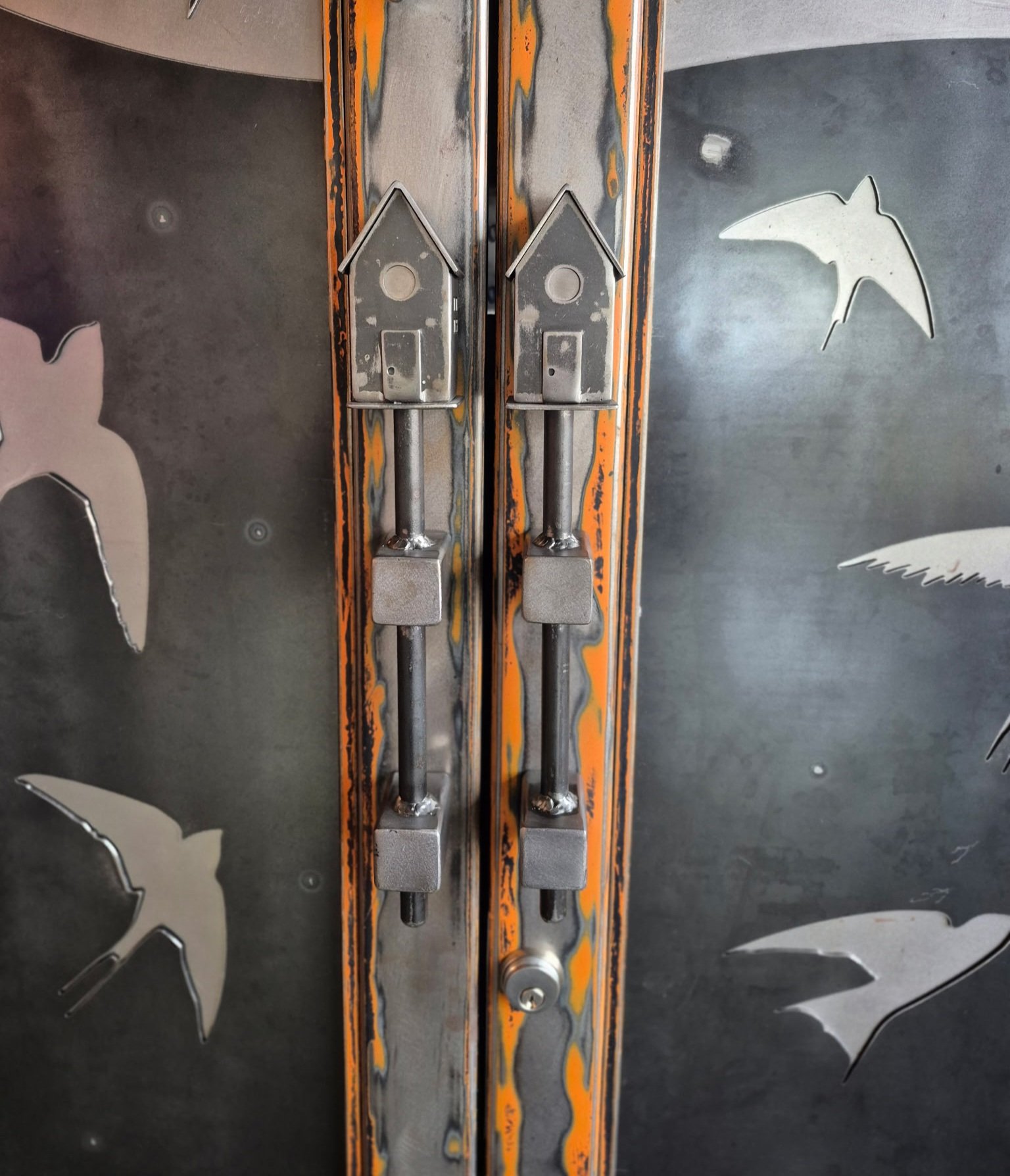 Custom fabricated metal birdhouse door pulls and custom metal decorative bird panels