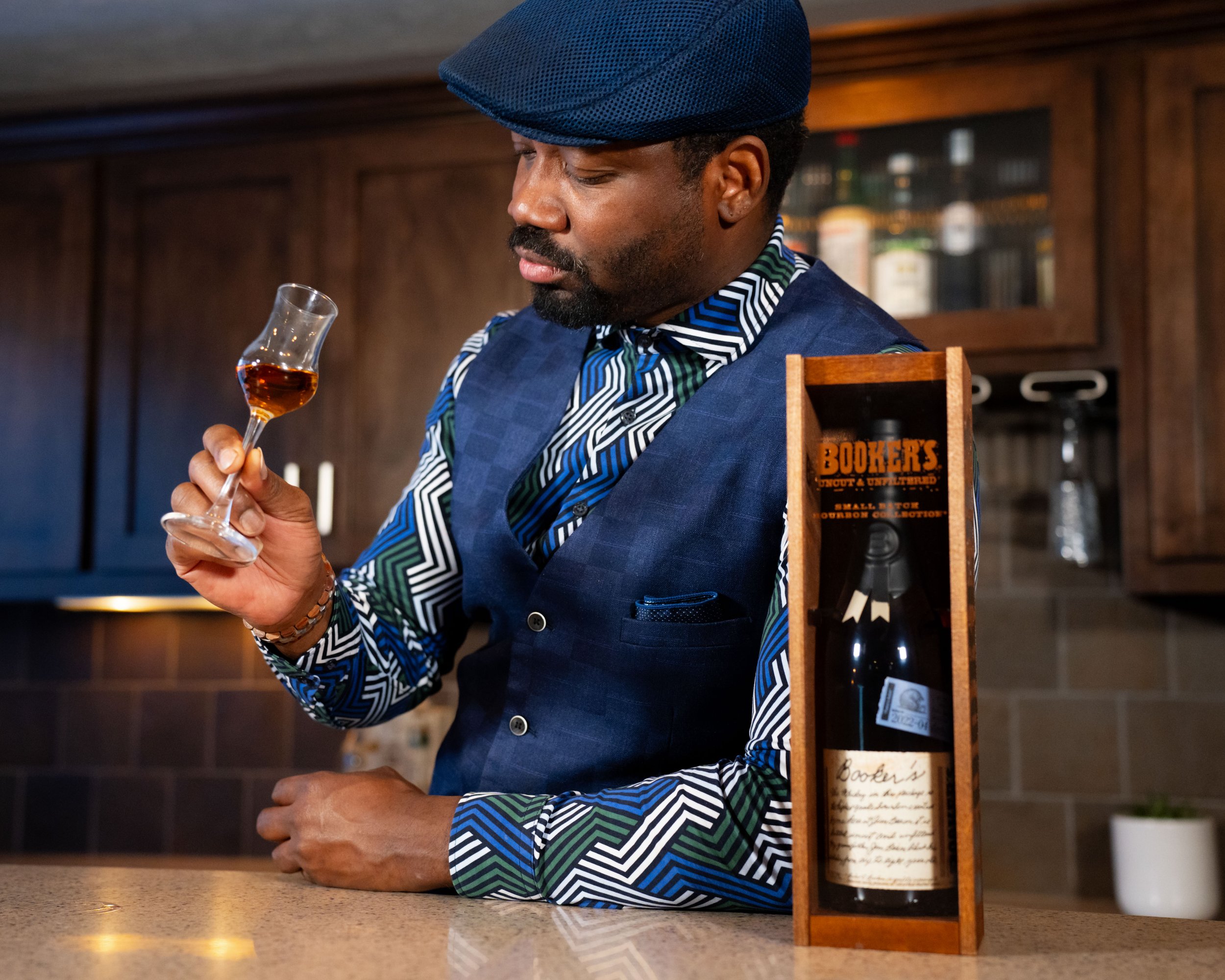 Deion enjoying a small glass of burbon