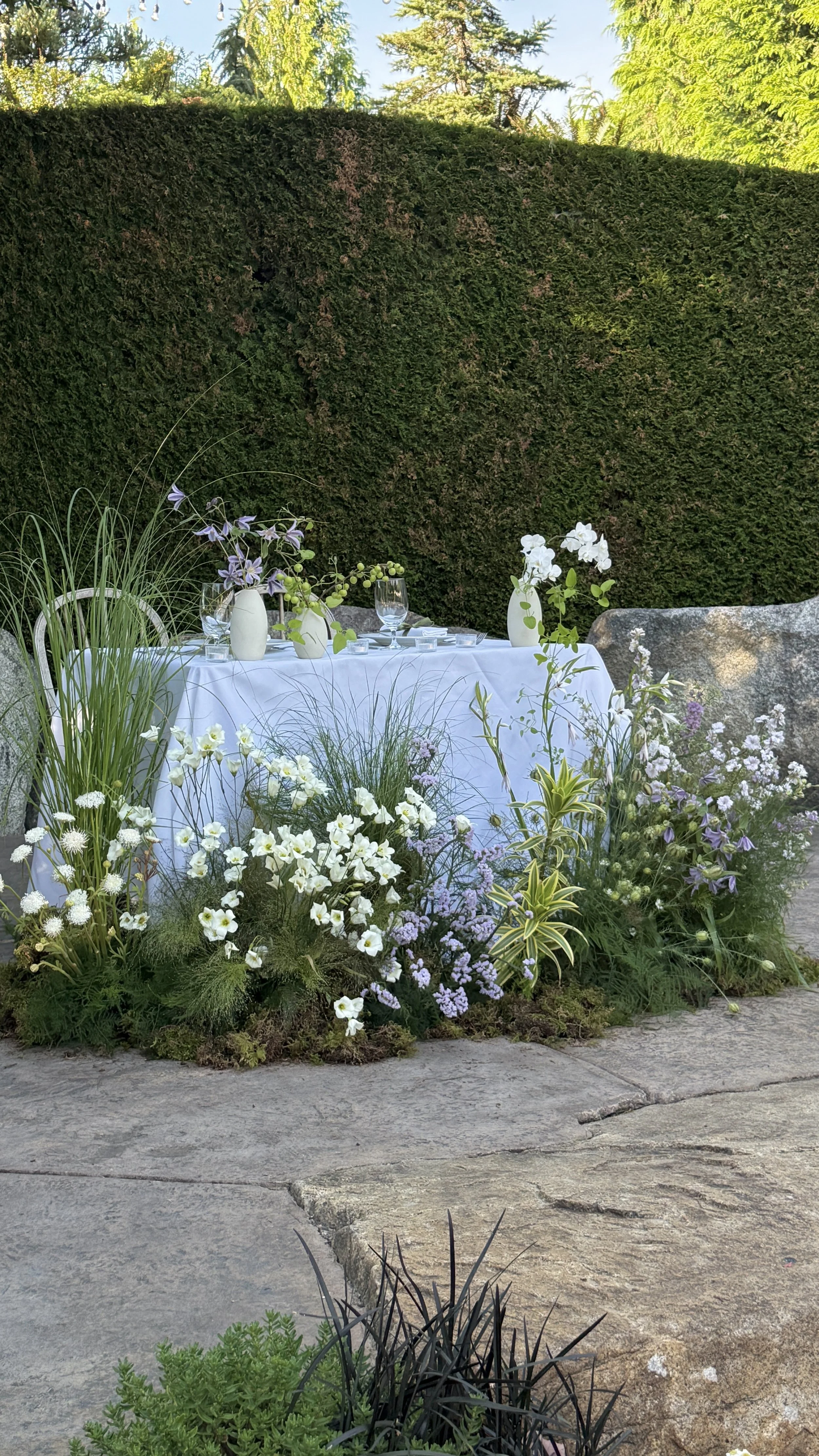Sweetheart table installation which was repurposed the ceremony meadow florals.