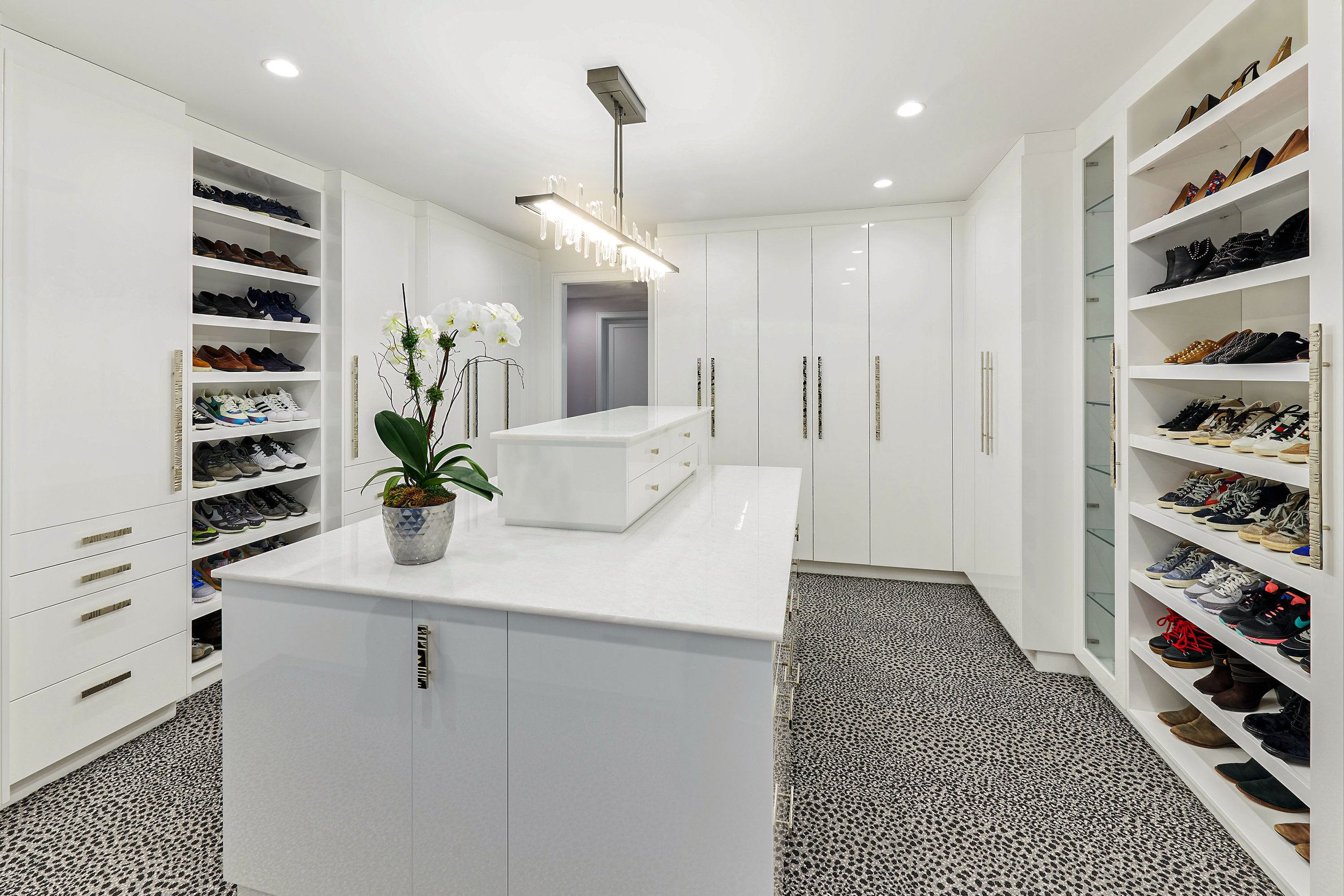 Short Hills in and out Design Studio-Modern white master closet.jpg