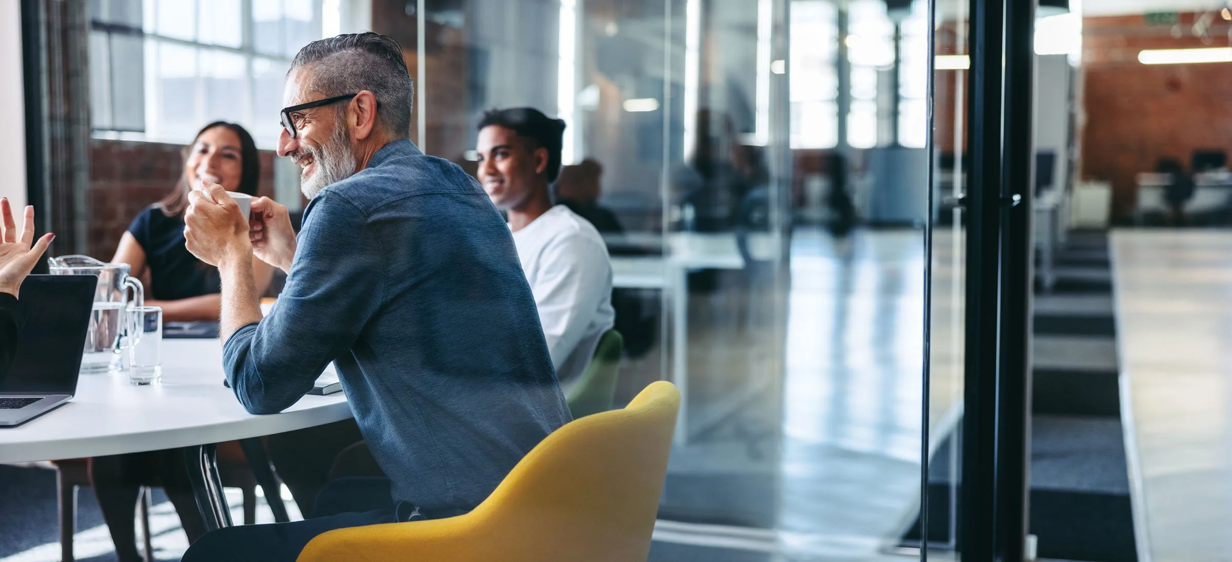 Close-up of diverse focus group participants engaged in conversation