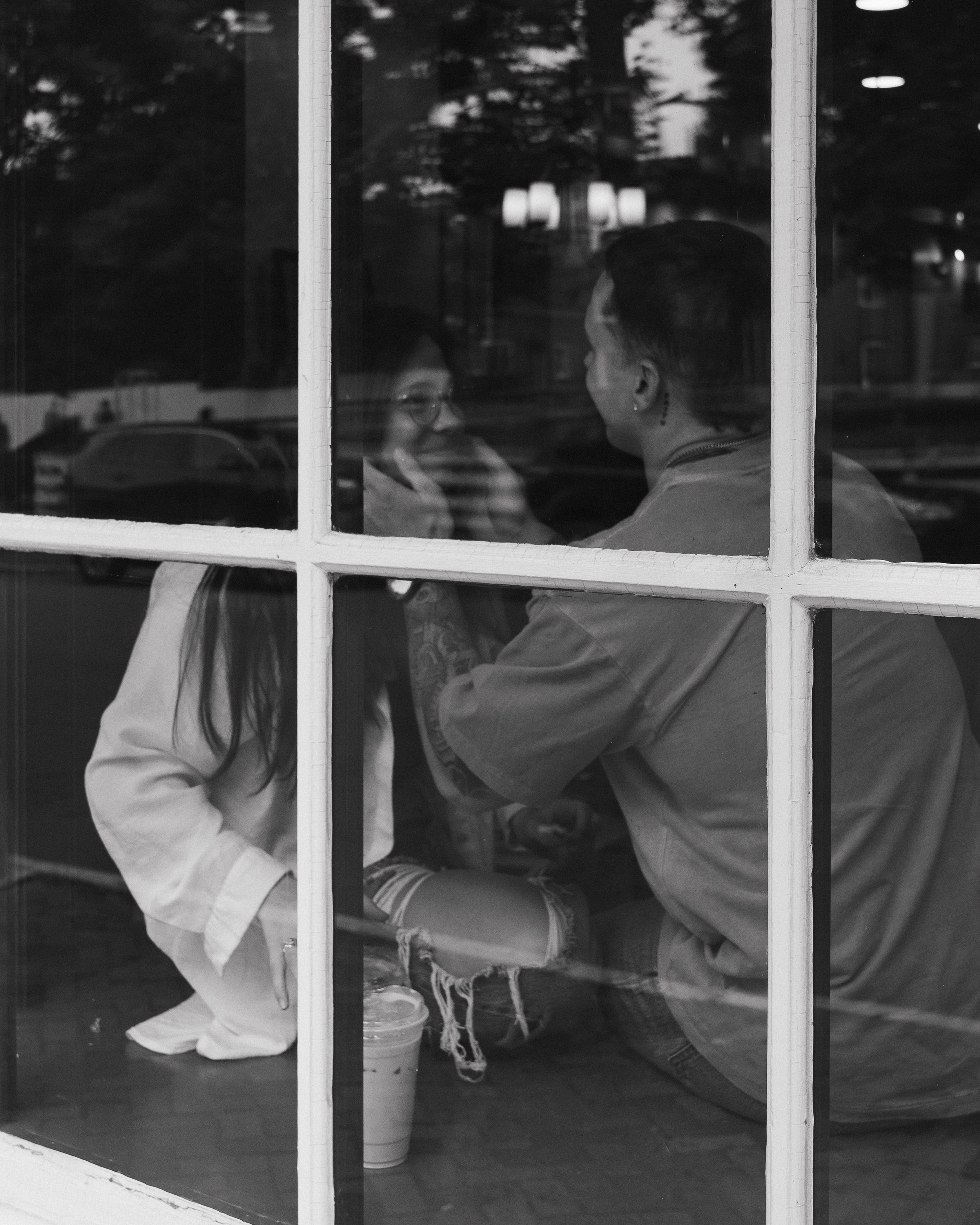 Couple sharing a quiet moment inside Lot 63 coffee shop in Old Salem Winston-Salem NC