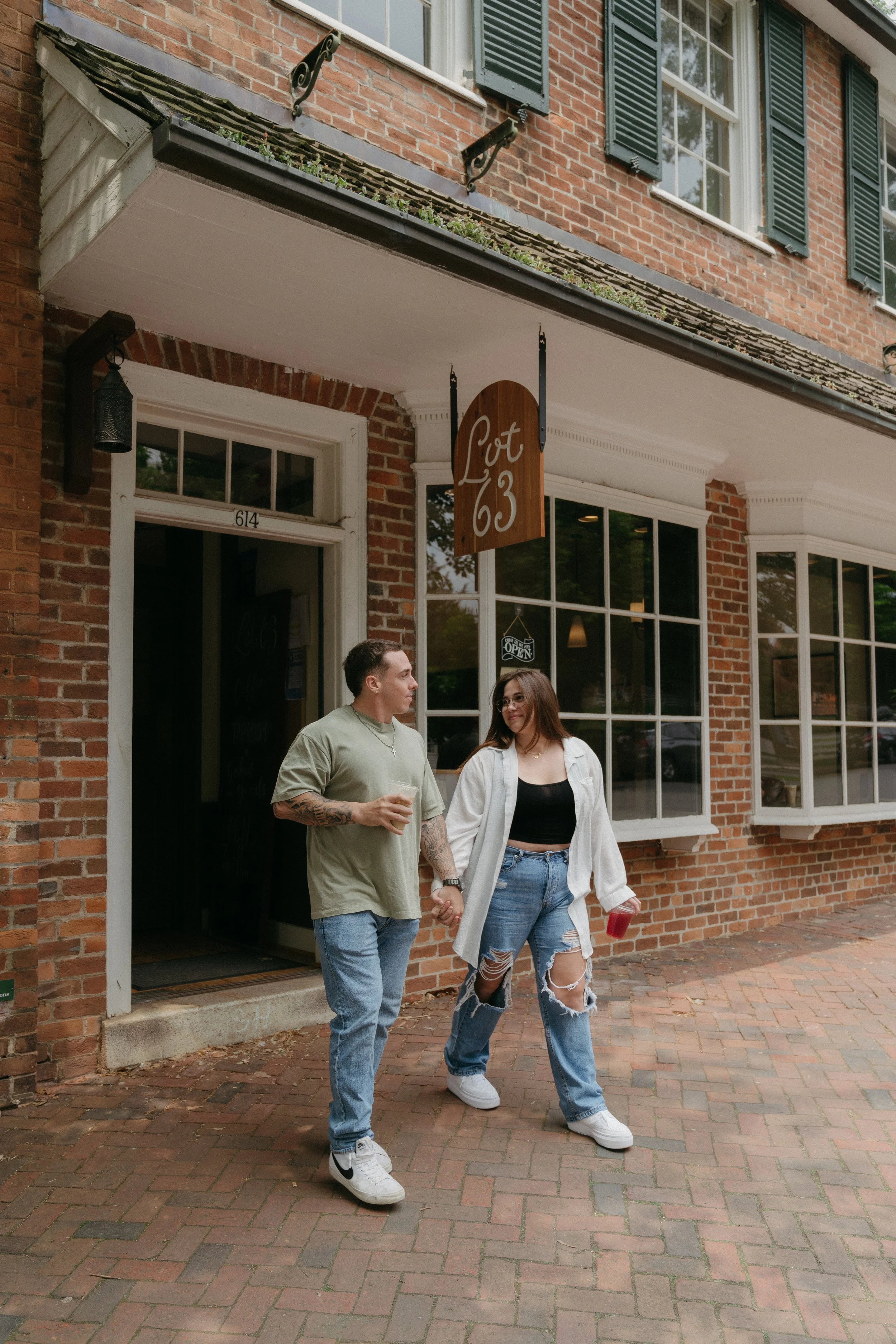 Couple sharing a quiet moment outside  Lot 63 coffee shop in Old Salem Winston-Salem NC