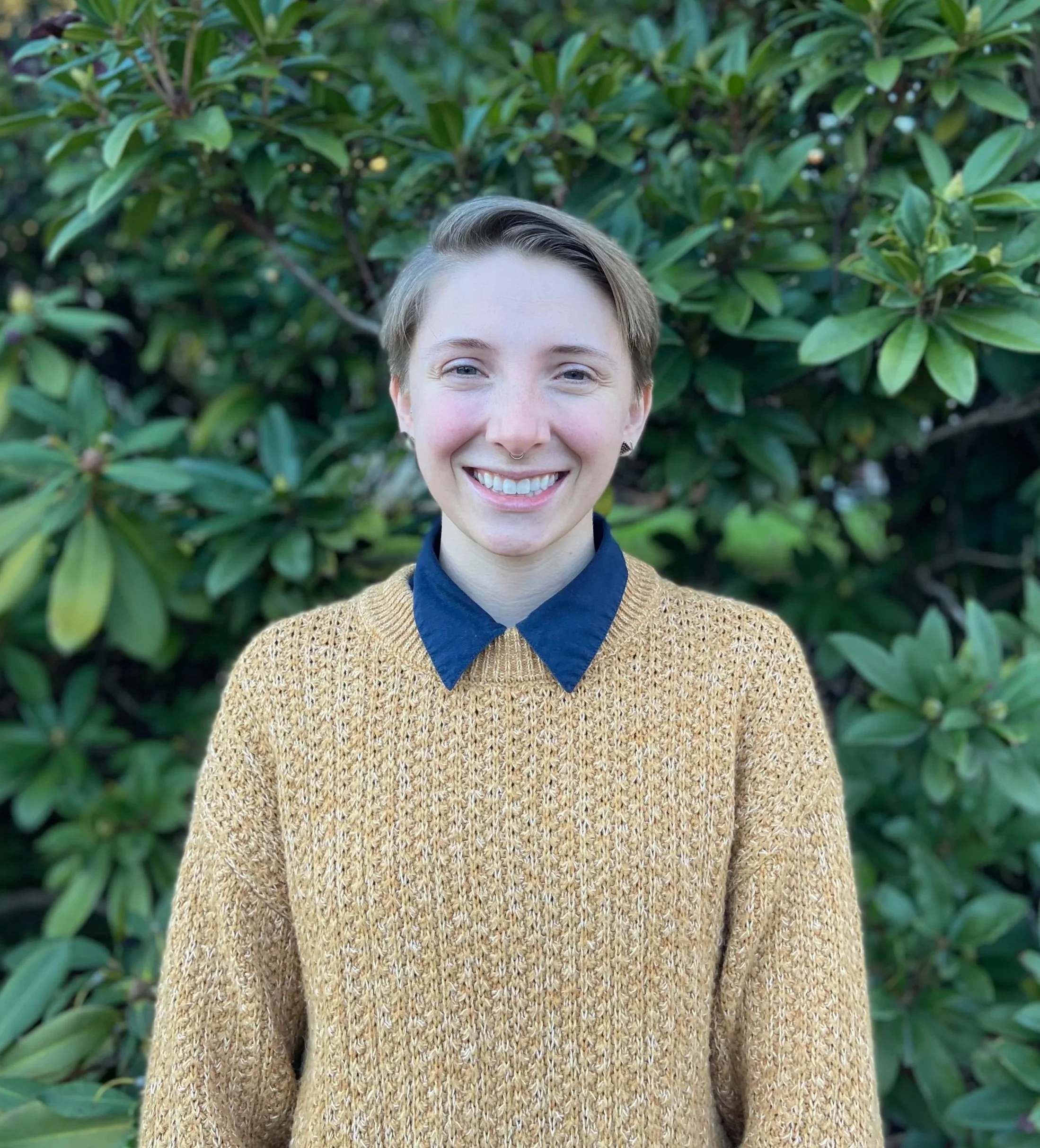 Mariah Frank, pelvic health physical therapist at mBody Health in Portland, Oregon, smiling outdoors