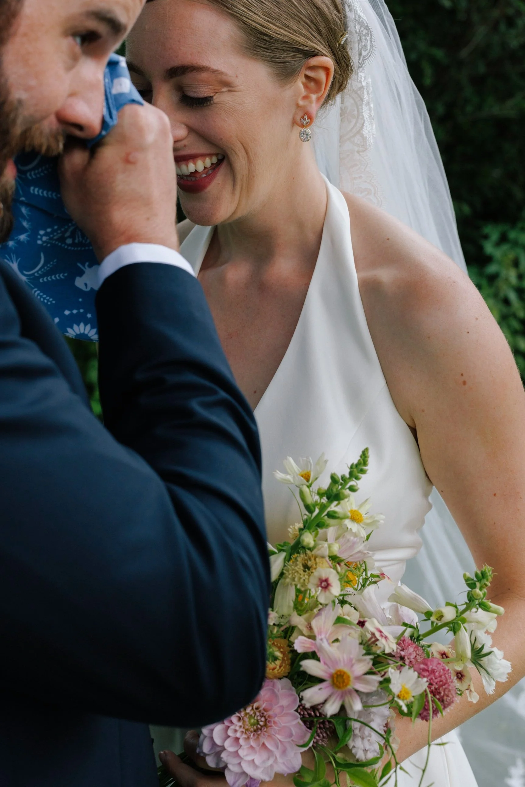 Wild flower bridal bouquet, happy tears at first look between bride and groom. Hudson Valley Wedding Florist. 