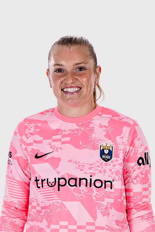 Reign FC goalkeeper Claudia Dickey in pink goalkeeper kit