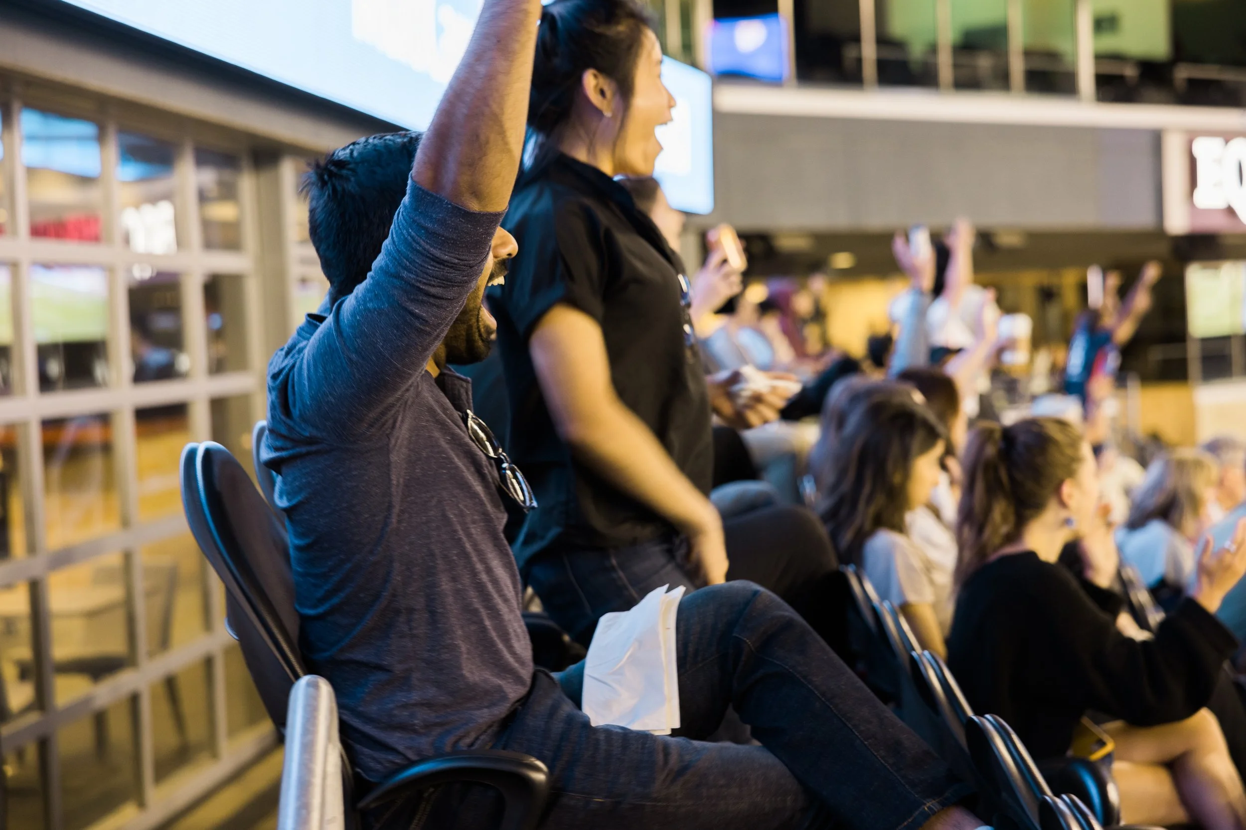 OL Reign fan cheering at the Reserve Club in Lumen Field