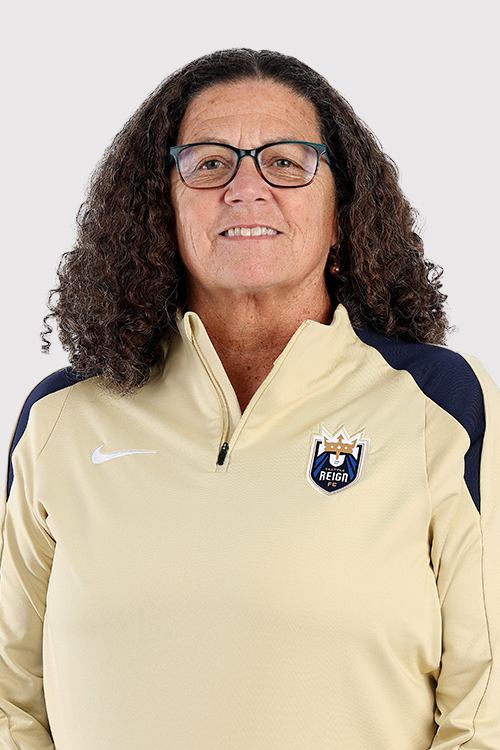 Lesle Gallimore in gold top with Reign logo