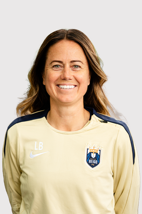 Lauren Barnes in gold Reign FC top
