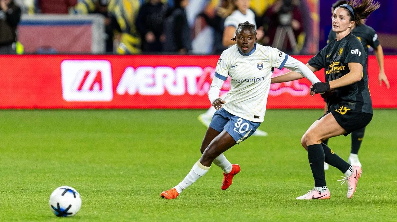 Nerilia Mondesir with the soccer ball