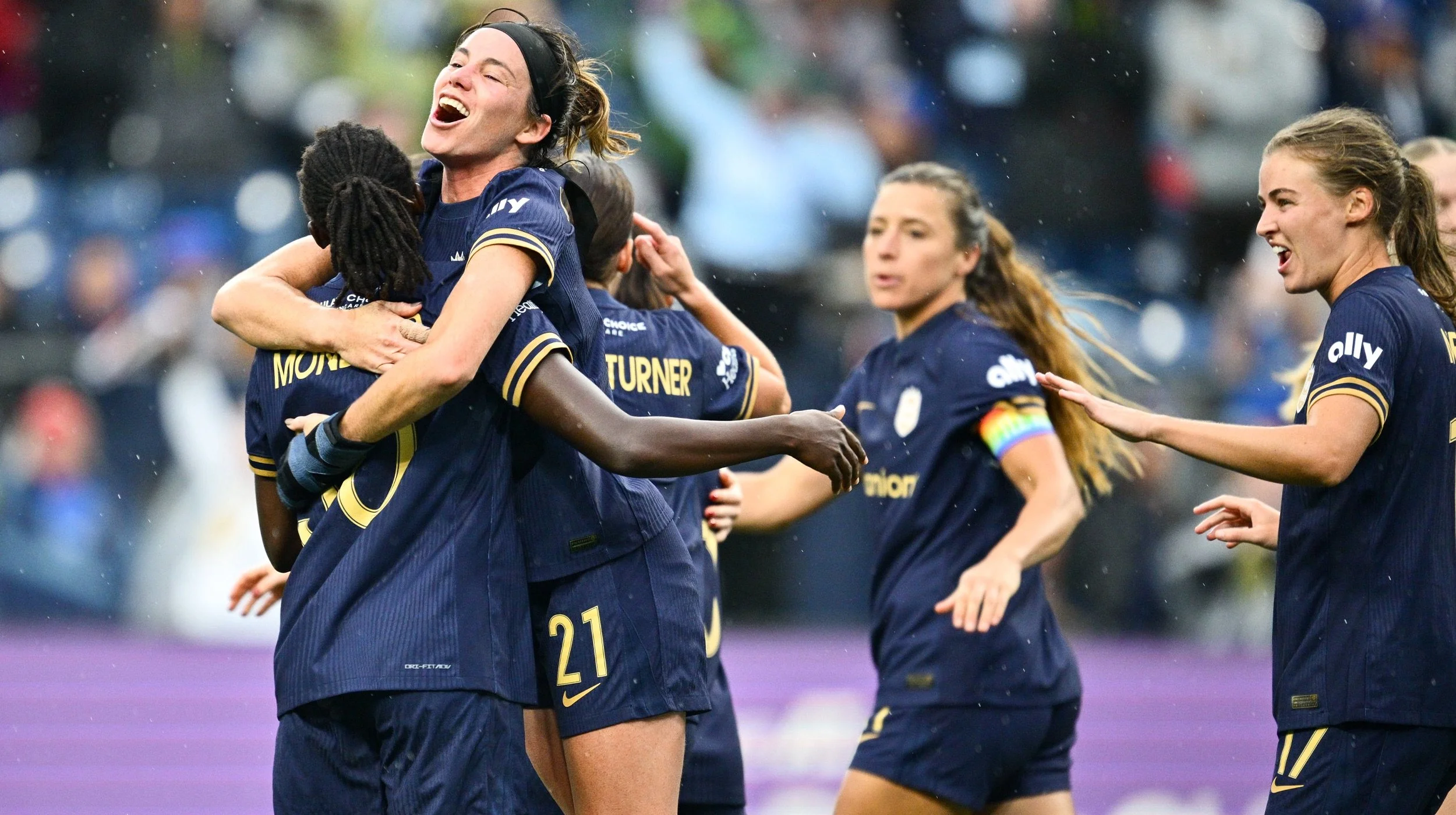 Reign FC team celebrating goal