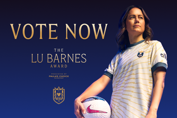 Lu Barnes holding a soccer ball