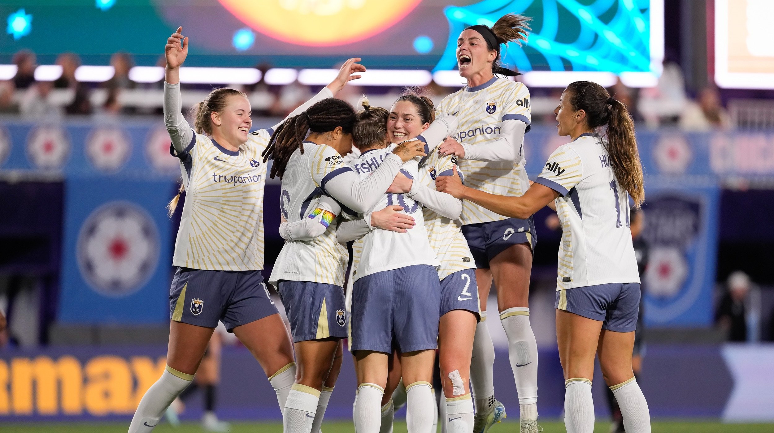 Reign FC team celebrating a goal