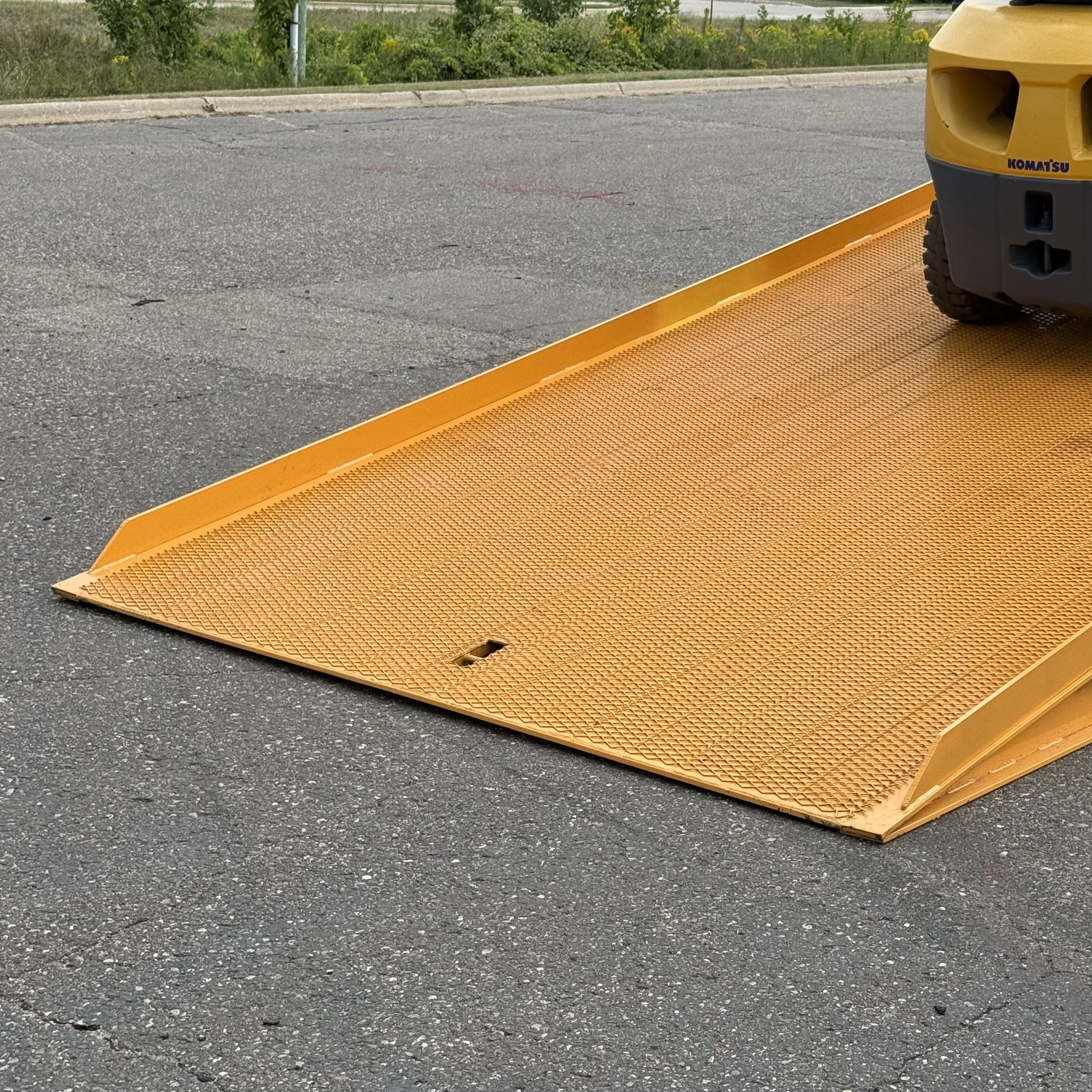 Heavy-duty wide yard ramp with extra space for forklift operation