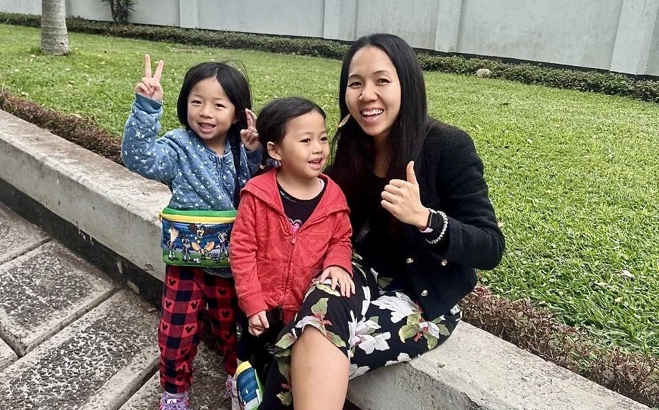 Wai Jia with her two daughters