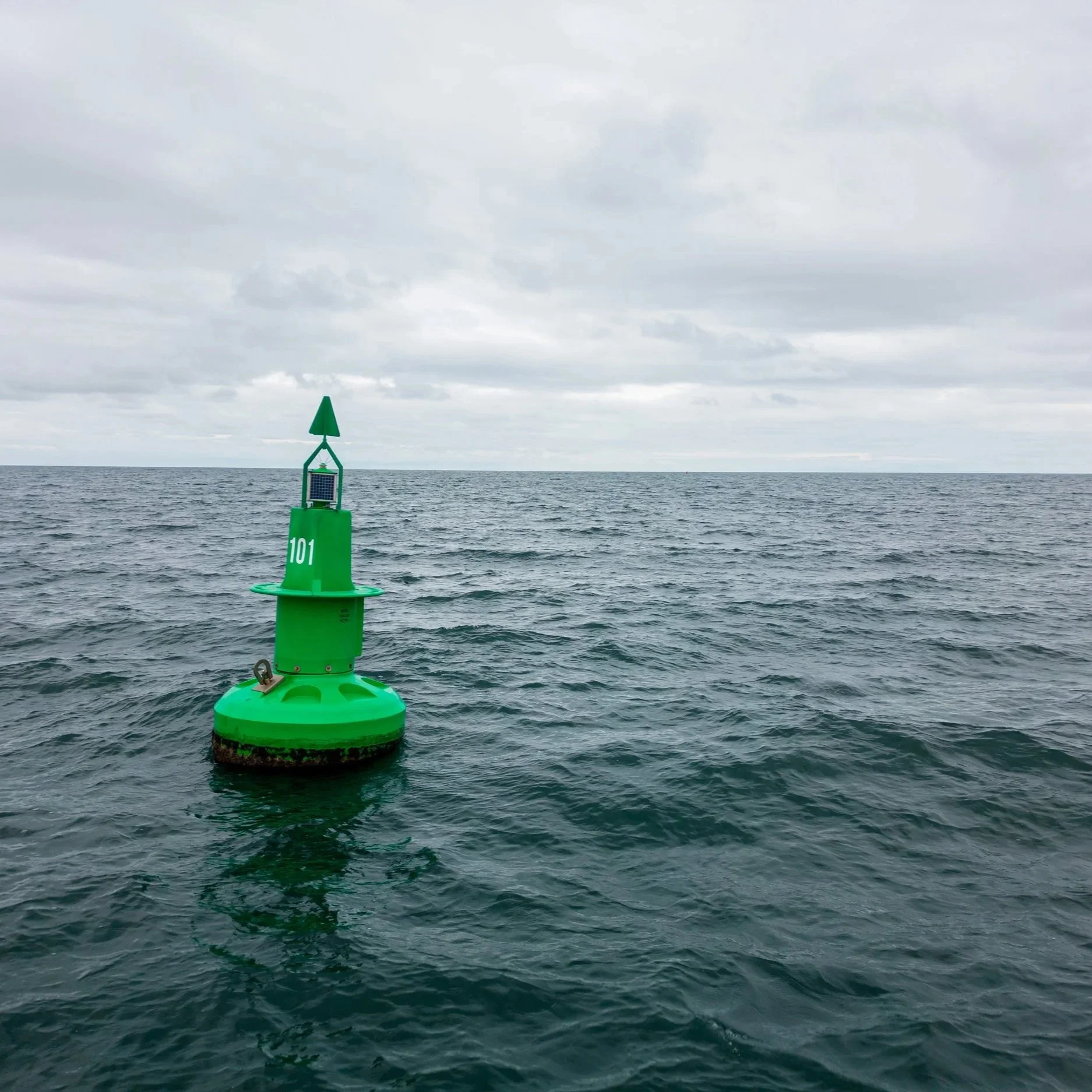 green-navigational-buoy-sea-with-clouds-slow-motion.jpg
