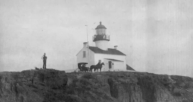 Old Point Loma Lighthouse with Robert Israel standing in front circa 1950s - 1960. Credit NPS