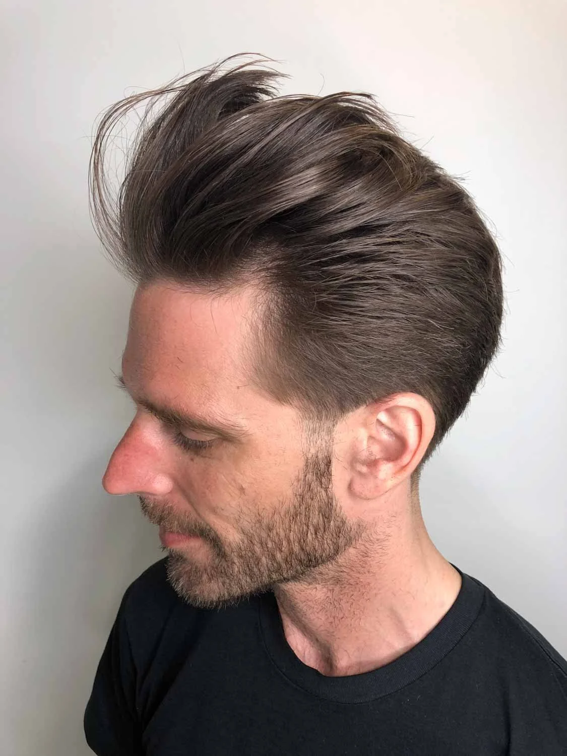 mid length mens hairstyle with low taper