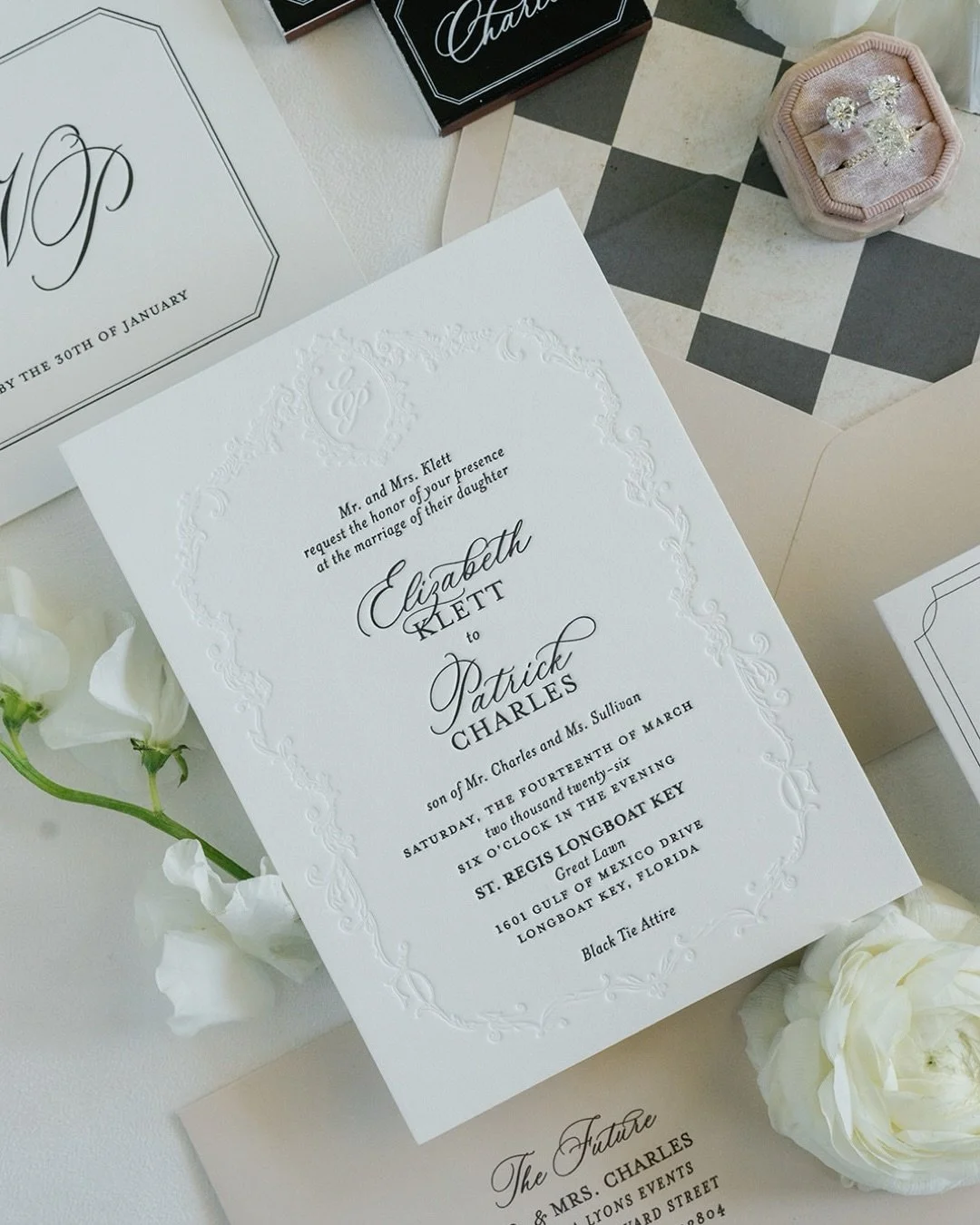 Classic. Refined. A black tie affair, defined by the details.

Every detail of Elizabeth &amp; Patrick&rsquo;s wedding was anchored by their custom monogram. The ornate Baroque frame and intertwined initials became a signature motif, thoughtfully ech