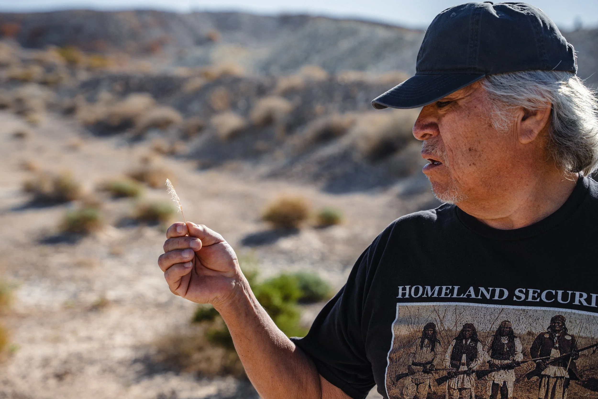 Ken Watterson Jr tries to identify a plant.