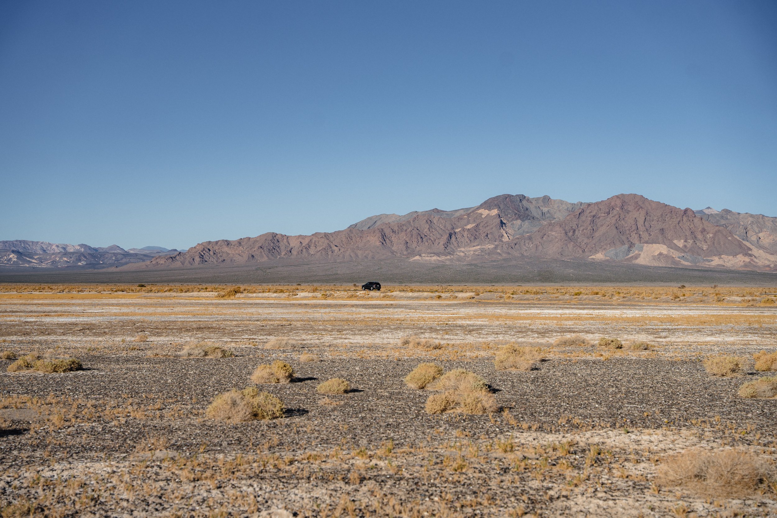 A car drives through Carson Slough near Death Valley Junction, Calif.