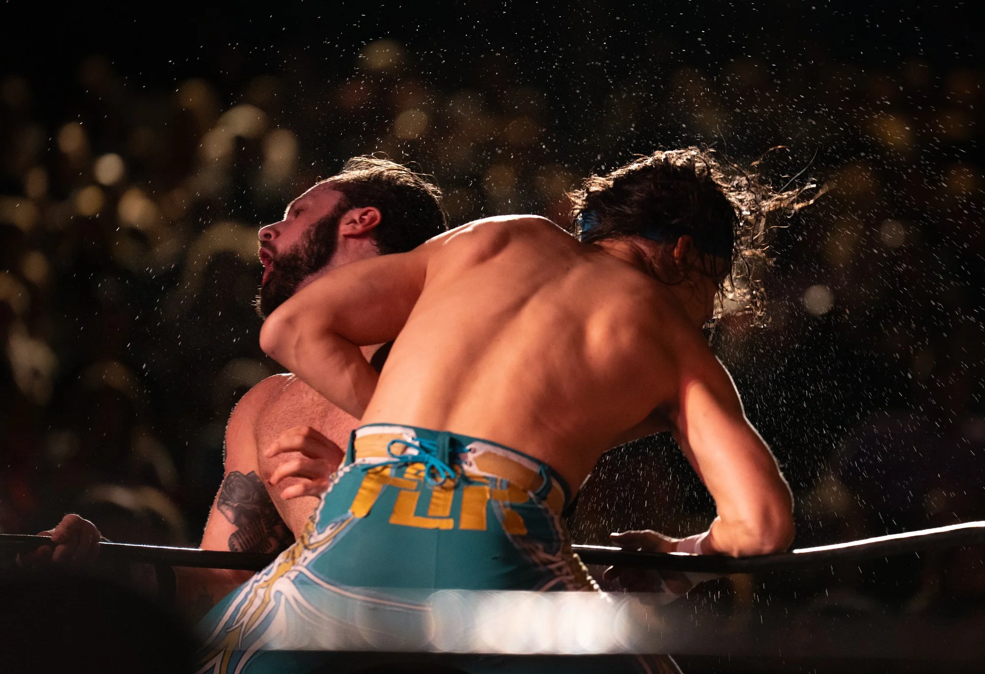 Sweat and spit fly as Drew Wood and Terry "The Flip" Sequoyah exchange blows during RVA Pro Wrestling's second appearance at the Dogwood Dell Festival of the Arts on Saturday, July 25, 2026, in Richmond, Va.