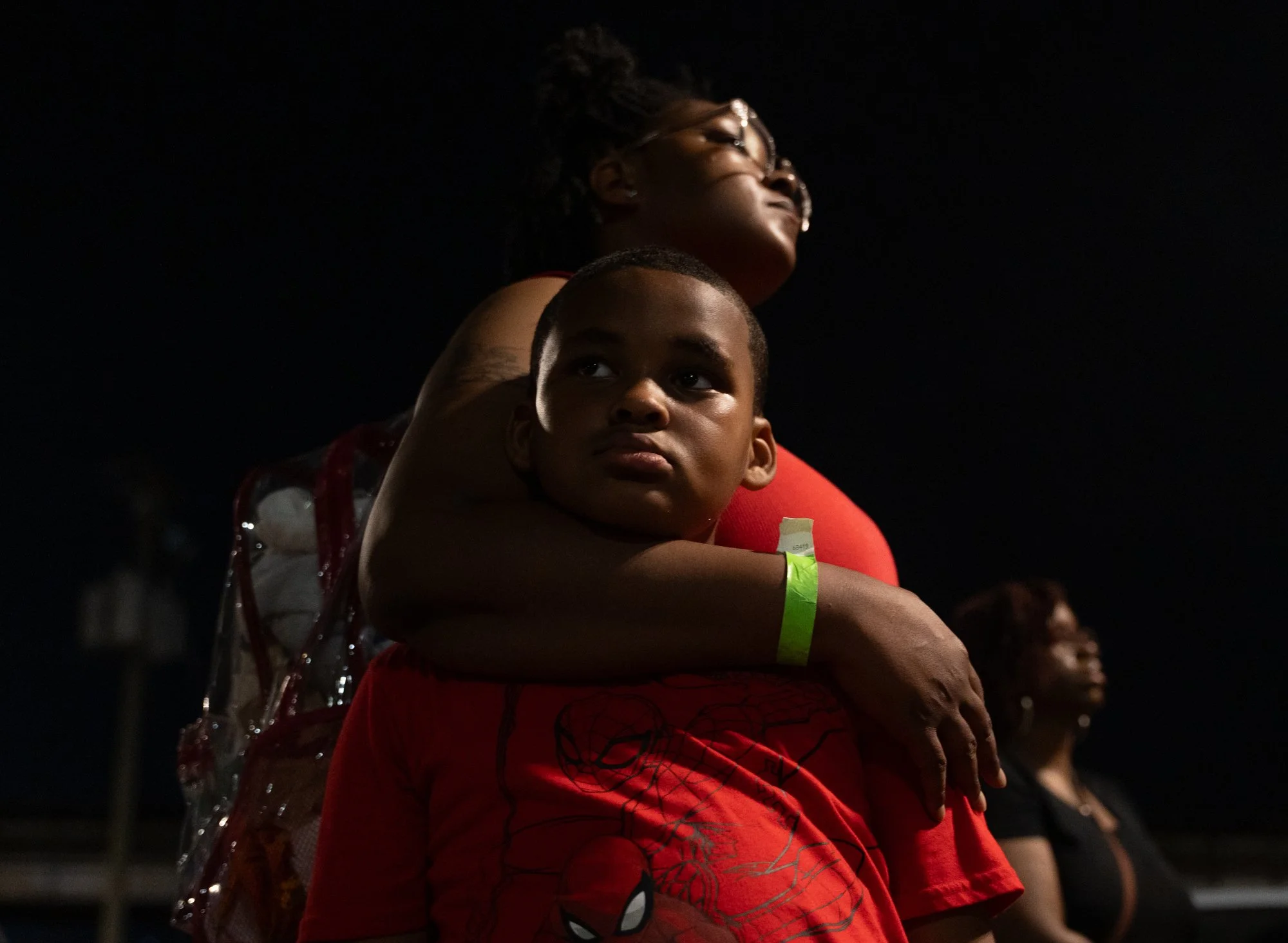 Kyree Byars, 7, listens to narratives performed at Lumpkins Jail at the end of the torch-lit night walk along the Trail of Enslaved Africans, hosted by the Elegba Folklore Society for Juneteenth on Saturday, June 13, 2026, in Richmond, Va.