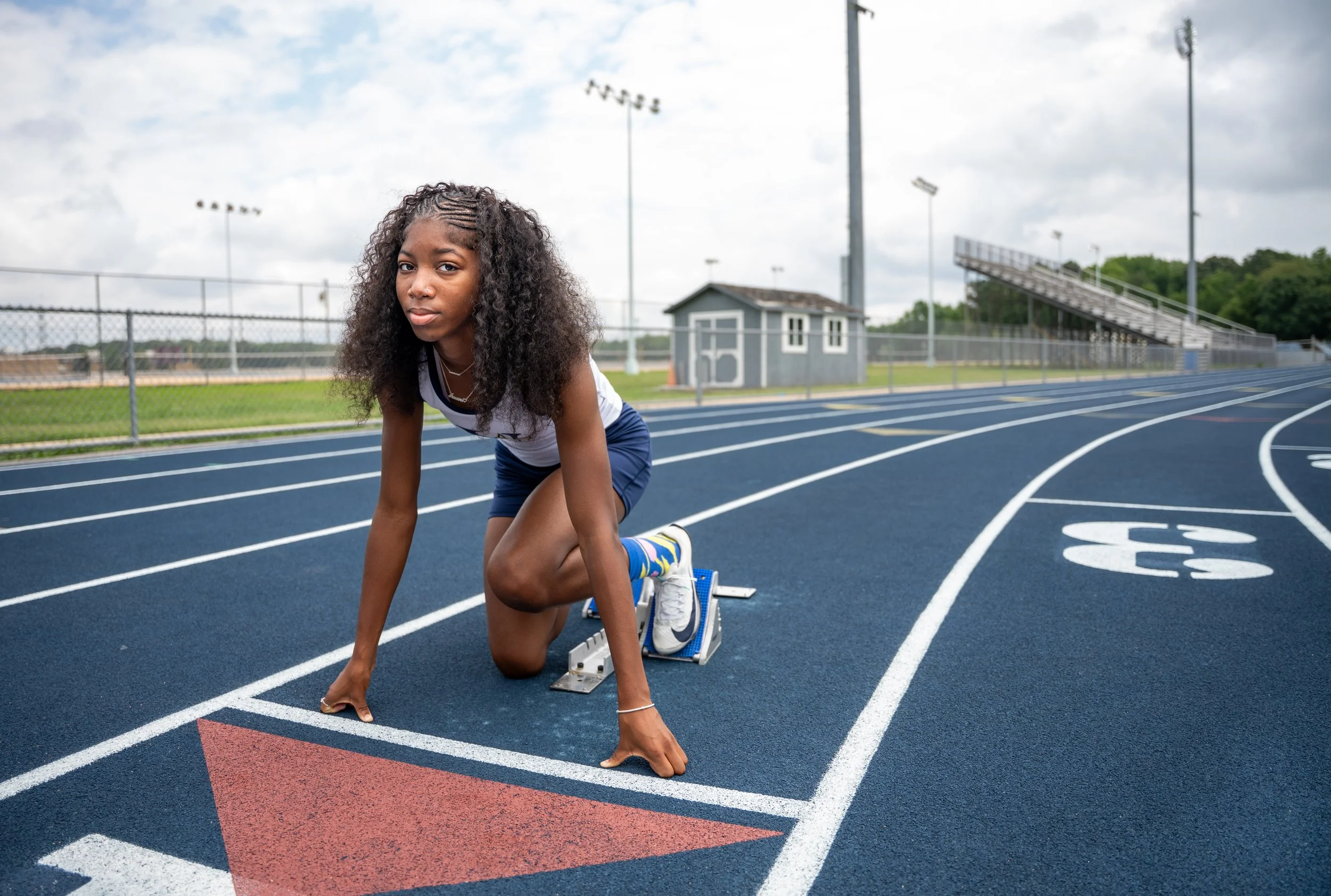 All-Metro Girls Track Player of the Year, Imani Moore, poses for a portrait on the track at Varina High School on Wednesday, July 8, 2026, in Henrico, Va.
