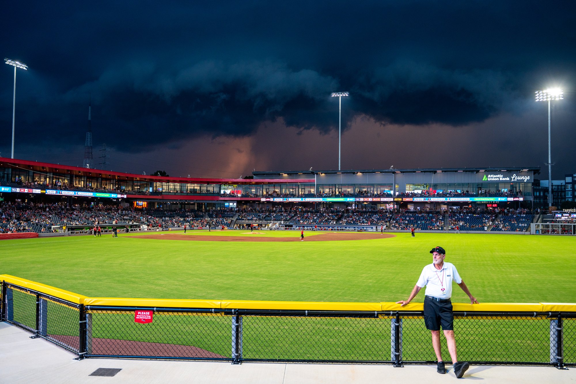 A thunderstorm rolls in overhead during the Richmond Flying Squirrels’ game against the Reading Fightin Phils on Friday, Aug. 7, 2026, in Richmond, Va. The Flying Squirrels won 10-9 after a rain delay.