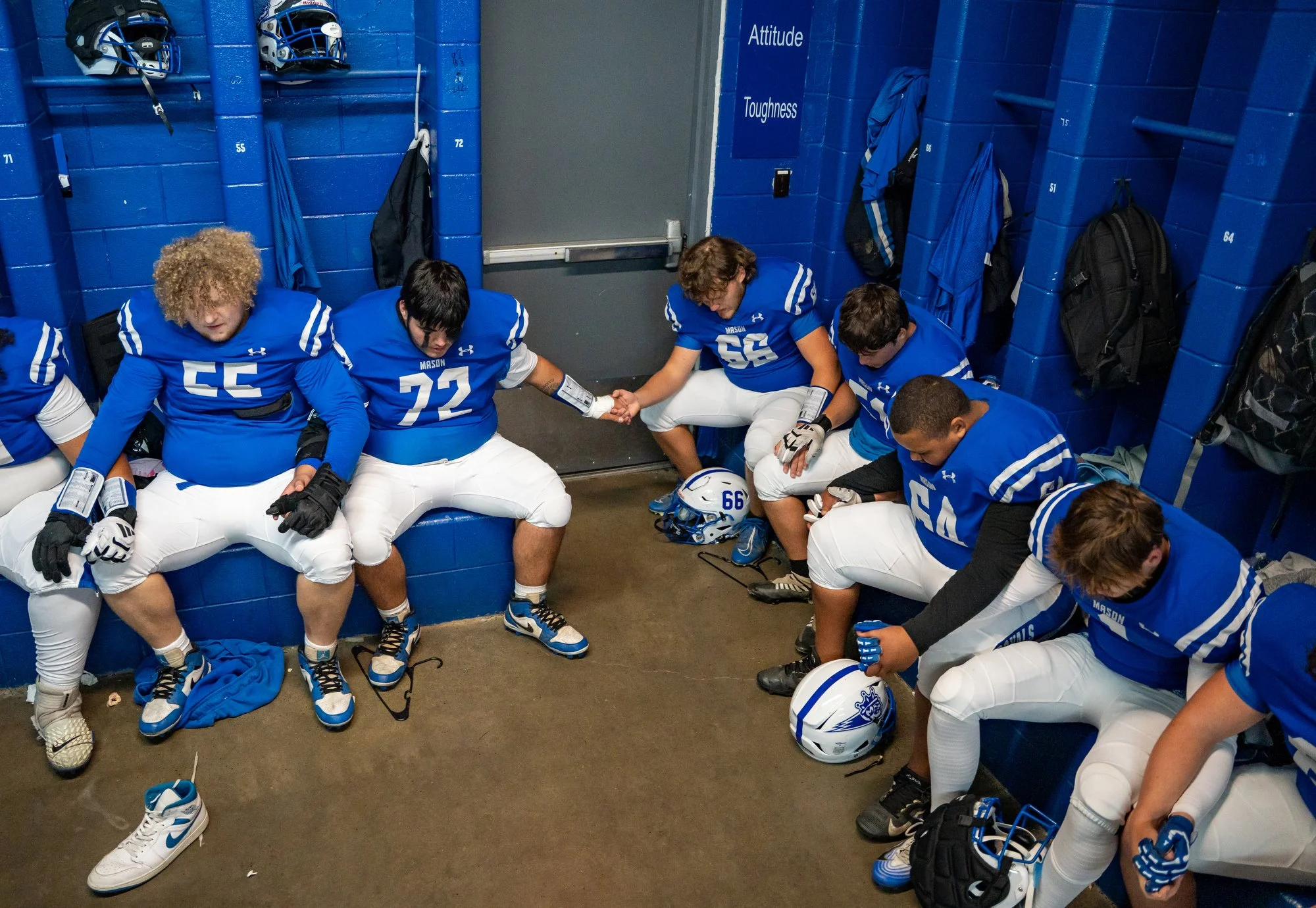 The Maysville varsity football team prays before its senior night game against an opponent on Oct. 24, 2025, in Maysville, Ky. Maysville lost the game 52-0.