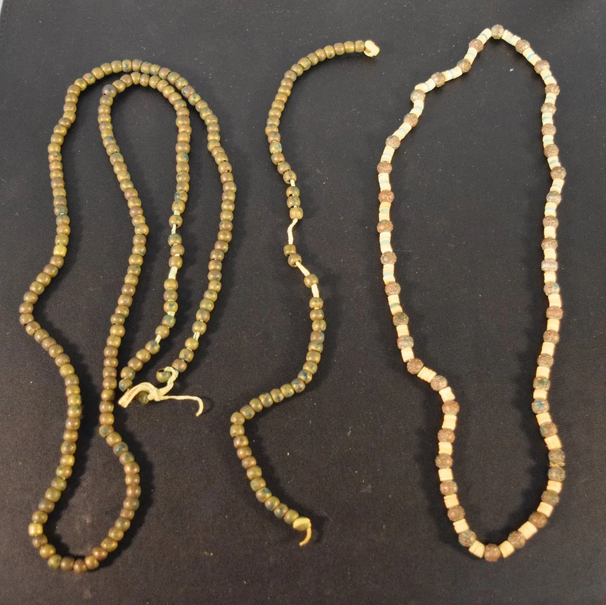 3 pcs: Brass & trade bead necklace; Small strand of brass beads & Brass and possible pucca shells necklace
