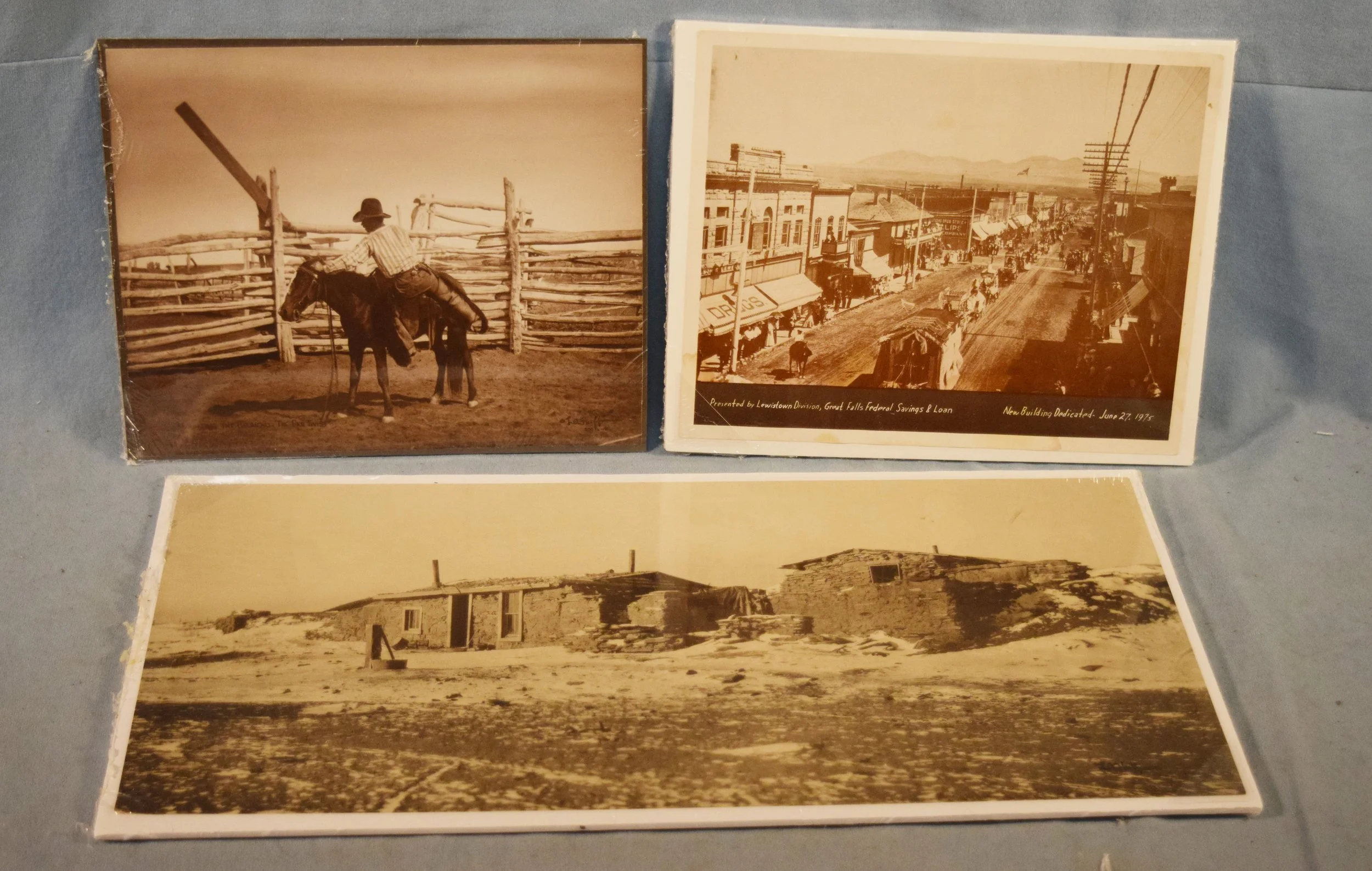 (3) L.A. Huffman prints: Mounting the Broncho - The Ear Twist, 8" x 10"; Main Street - New Building Dedication, 7.5" x 9.5",June 27, 1975, presented by Lewistown Division of Great Falls Federal Savings & Loan; Old Homestead, 8.75" x 18.5"