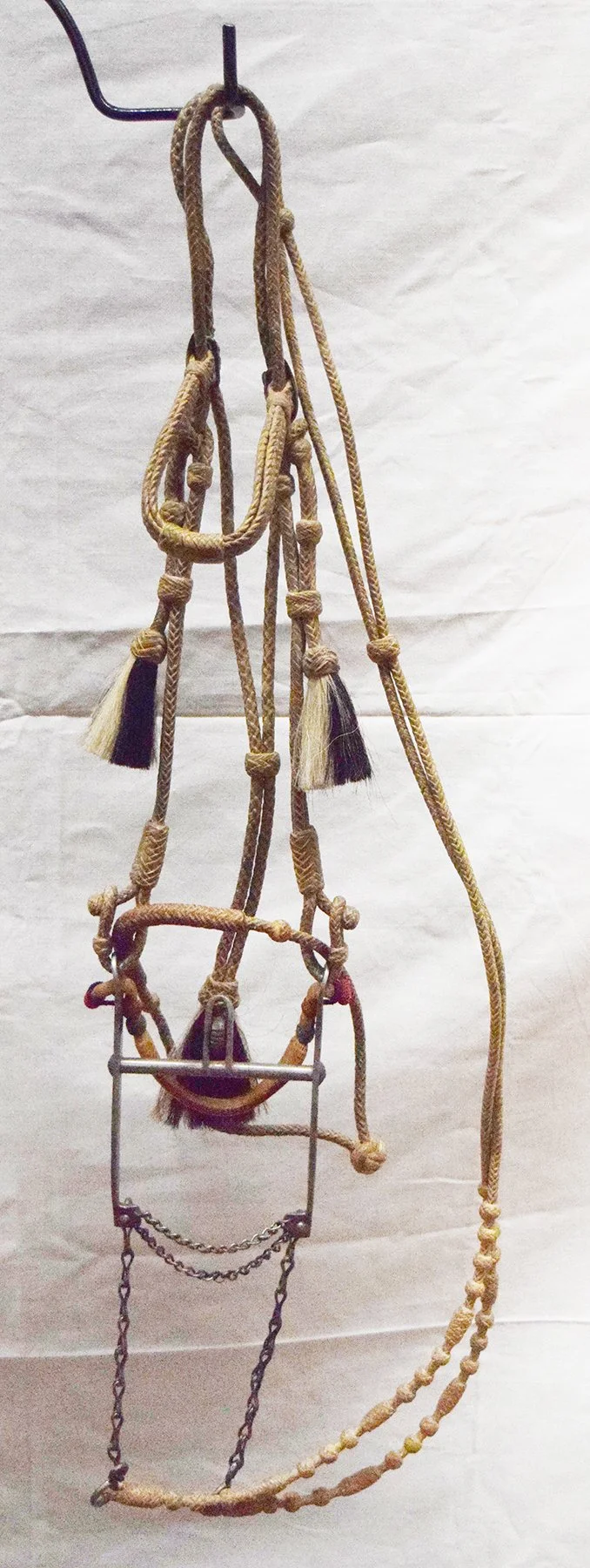 Wyoming State Pennitentary silver inlaid bit w/rawhide braided bridle w/ horsehair pufofs, bit stamped Sara J Wilson 320-43-2358, mint condition 
