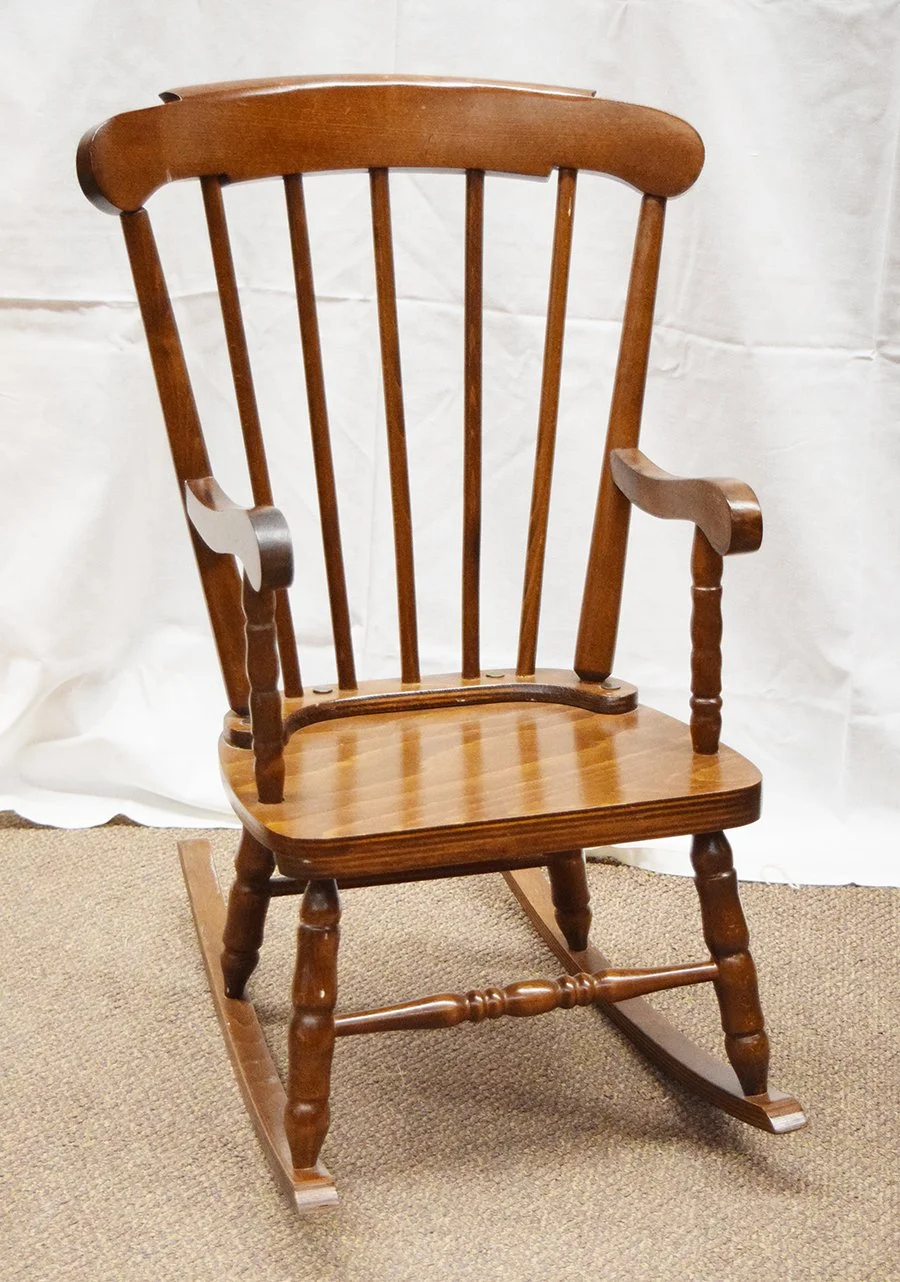 Child's wooden rocker, spindle back with dark stain, 29" tall, seat 12" x 10.5"